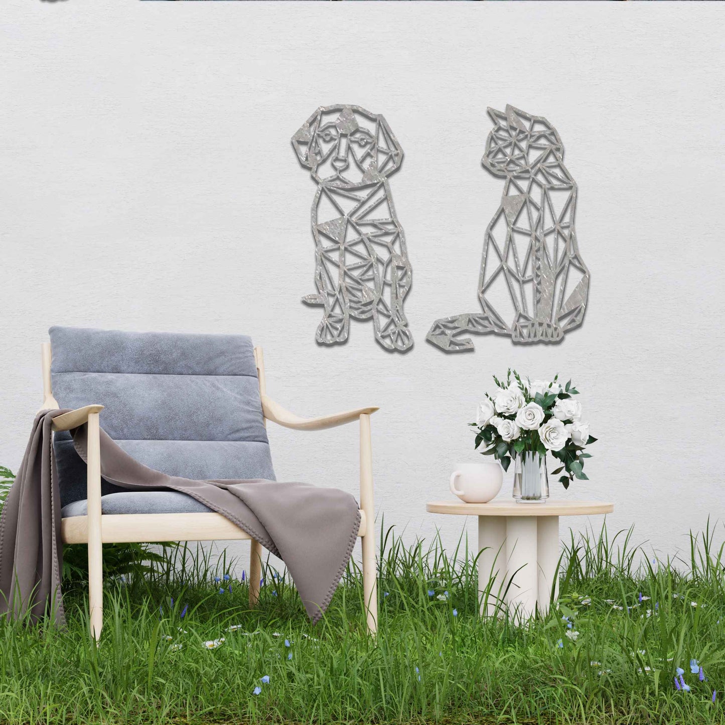 This image displays geometric-style black metal art featuring a dog and a cat, placed side by side. The angular, modern design of the animals contrasts beautifully with the natural greenery around, offering a stylish touch to the surrounding space.