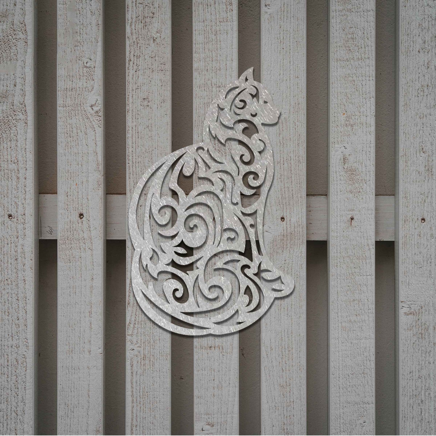 This design features a silhouette of a cat in profile, its body adorned with intricate swirls and patterns. The cat sits gracefully, showcasing elegant detailing throughout the design.