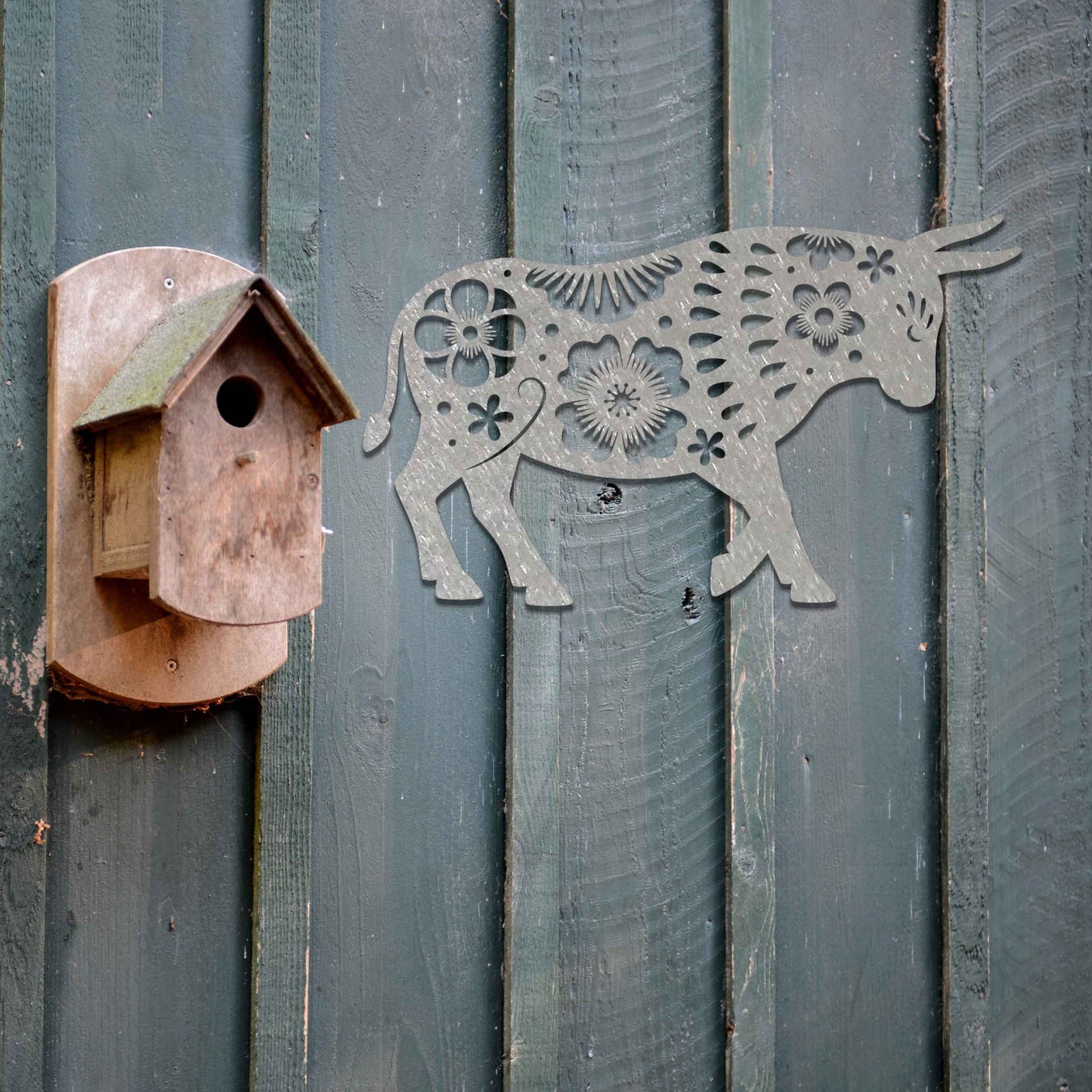 The design showcases a bull adorned with intricate floral patterns, blending natural strength with delicate details. The bold shape of the bull is enhanced by the flower motifs, giving it a unique and artistic appearance.