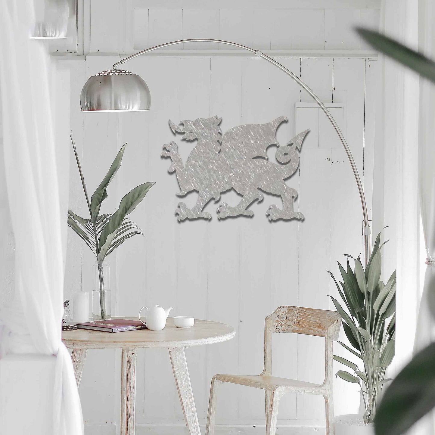 This image features the Welsh dragon, an iconic and powerful symbol of Wales. The design emphasizes the dragon’s fierce stance, with detailed wings, sharp claws, and an arched tail. Its strong profile is bold, representing strength and heritage, while the rustic, weathered finish gives the artwork a timeless, historic feel.