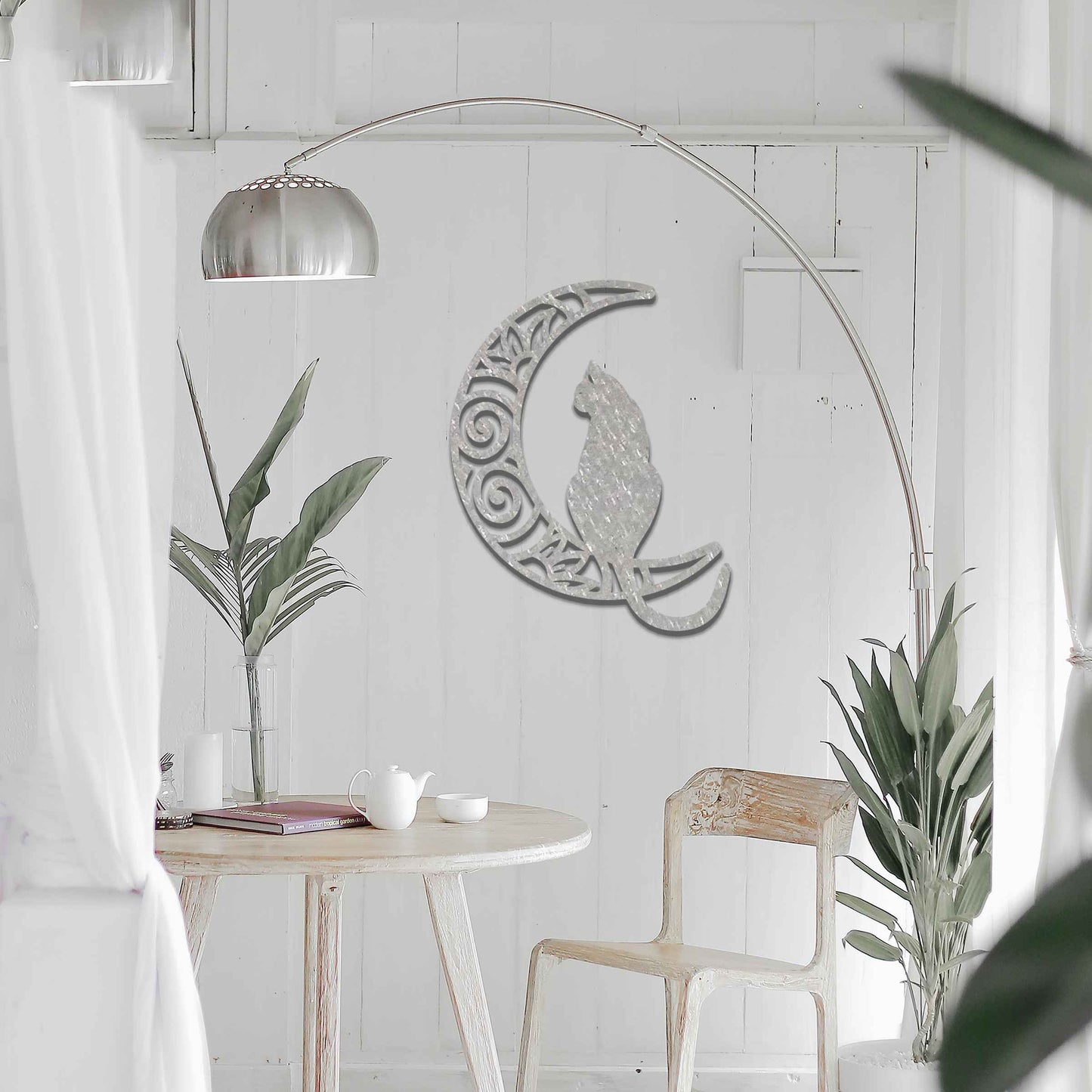 Metal garden decoration featuring a silhouette of a cat sitting on a crescent moon with intricate swirl and floral patterns, adding a mystical and elegant touch to outdoor or indoor walls.