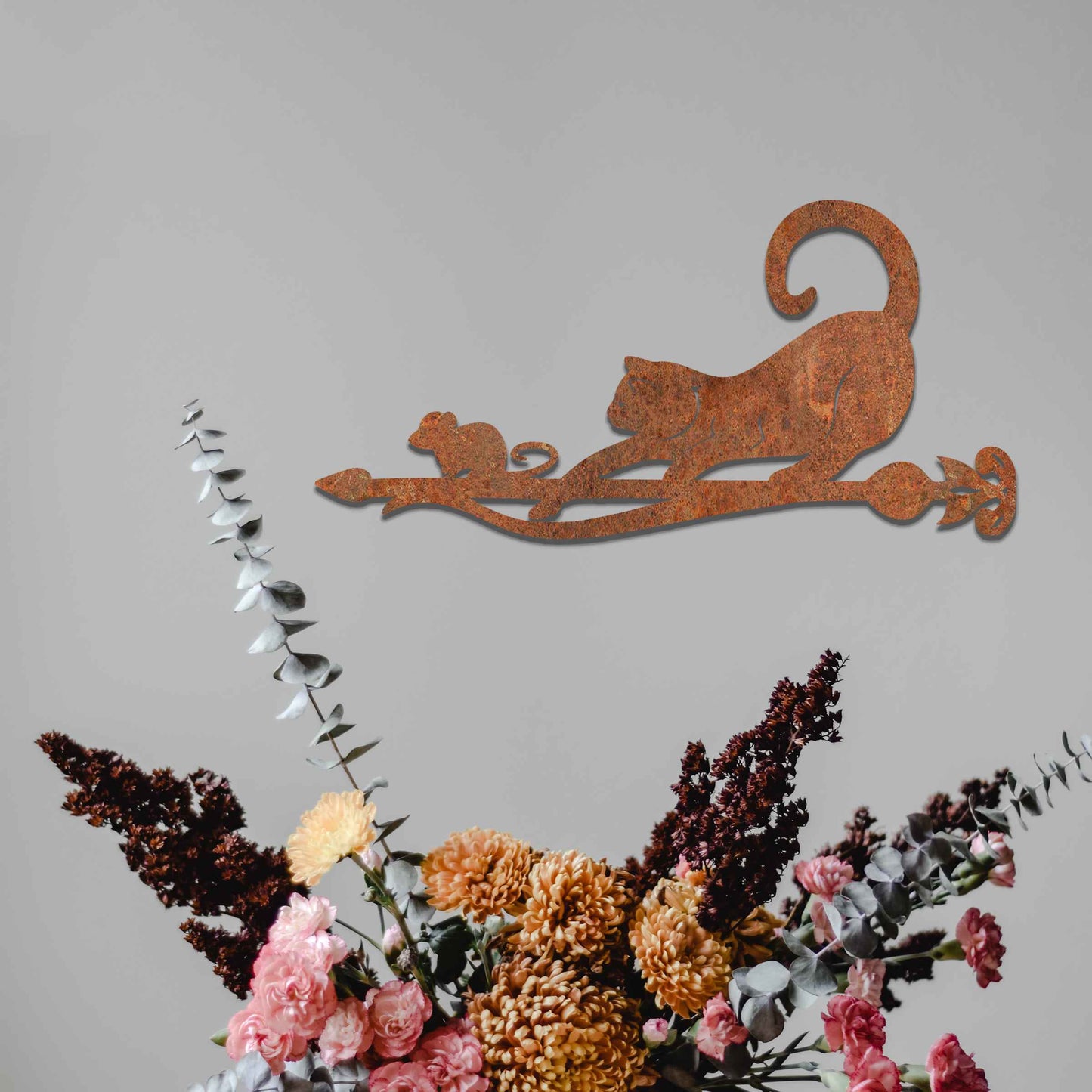 Metal garden decoration featuring a playful cat and mouse silhouette on a decorative branch, crafted with intricate details and a rustic finish, adding a whimsical and charming touch to outdoor spaces.