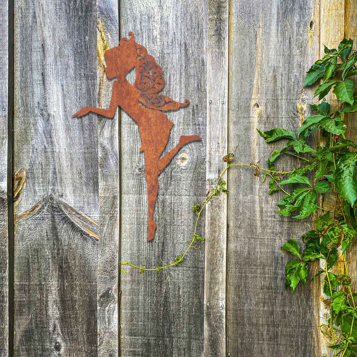 Thank you for the clarification! The design features a silhouette of a fairy in a graceful pose, with flowing hair and wings. The fairy is captured in mid-motion, bringing a sense of whimsy and elegance to the artwork.