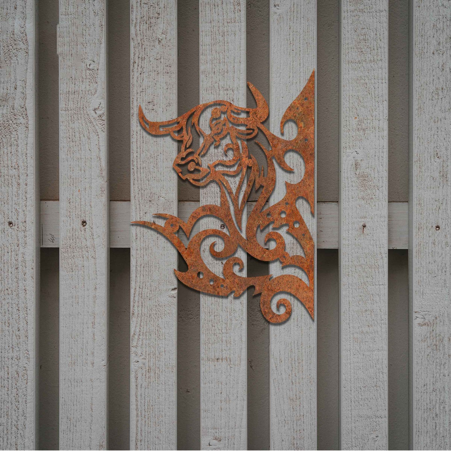 This design showcases a bull's head surrounded by dynamic, swirling lines. The intricate detailing captures the strength and power of the bull, with the bold and stylized swirls adding a sense of motion and energy.