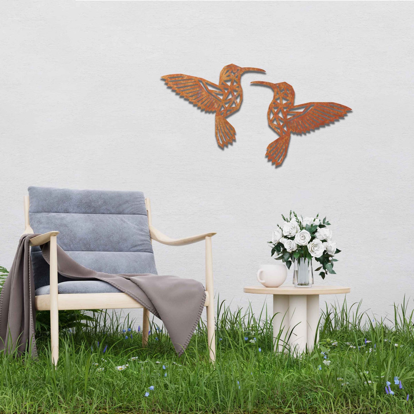 Metal garden decoration featuring two hummingbirds with geometric patterns in a dynamic pose, intricately designed to add elegance and a nature-inspired artistic touch to outdoor walls, fences, or garden sheds