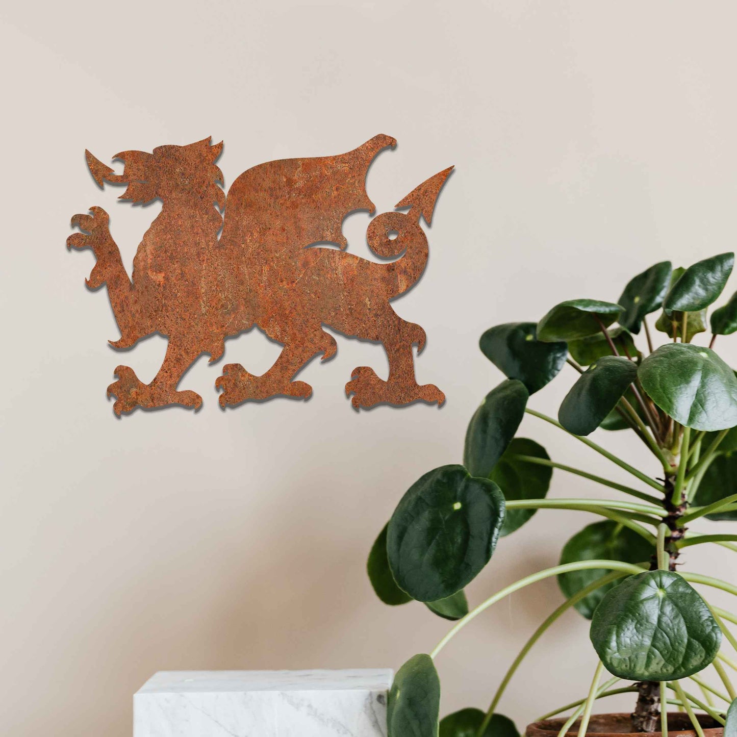 This image features the Welsh dragon, an iconic and powerful symbol of Wales. The design emphasizes the dragon’s fierce stance, with detailed wings, sharp claws, and an arched tail. Its strong profile is bold, representing strength and heritage, while the rustic, weathered finish gives the artwork a timeless, historic feel.