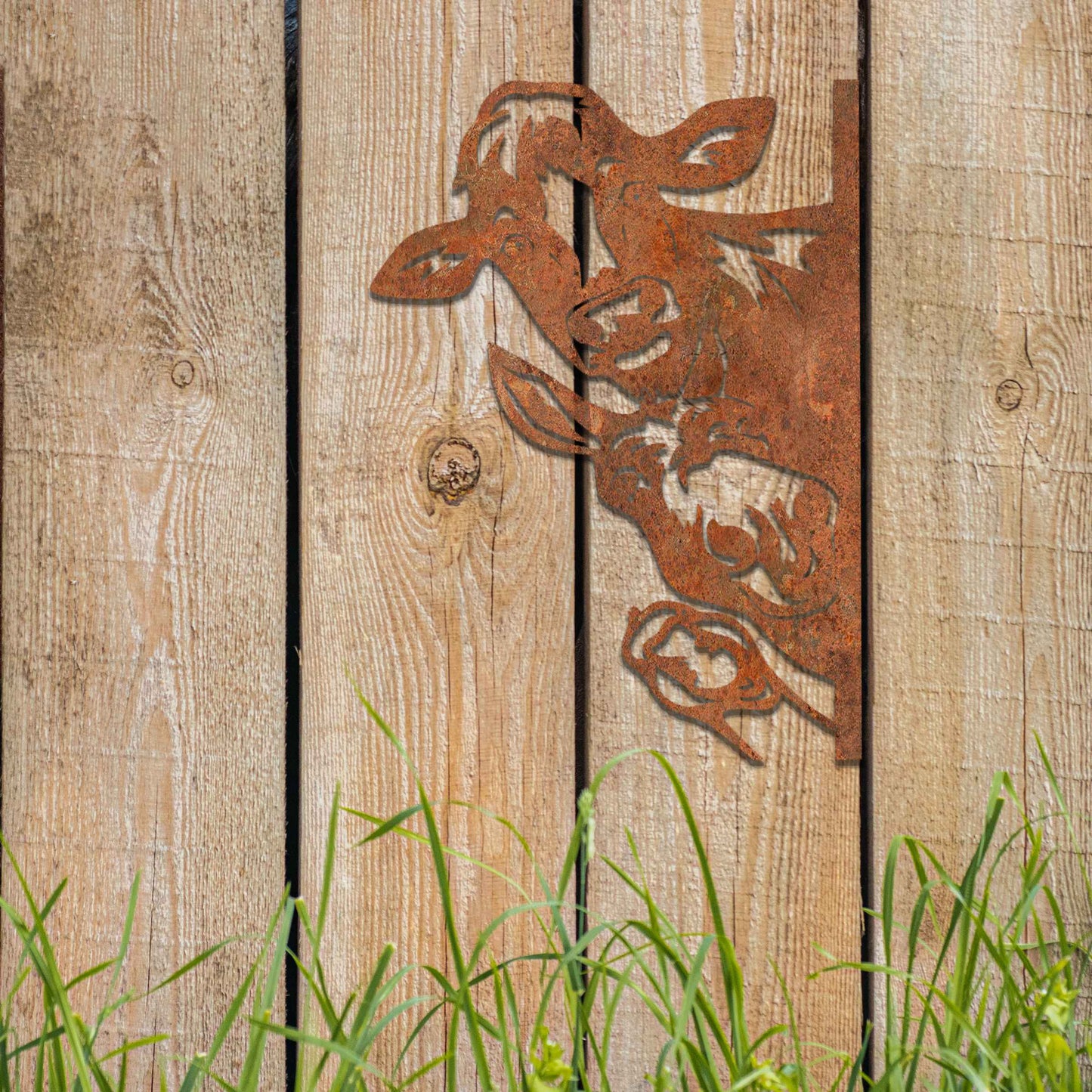 Metal decoration featuring a cow, a donkey, and a goose peeking around a vertical edge, crafted with intricate cutout details and a rustic finish, adding a whimsical and rustic charm to outdoor or garden spaces.