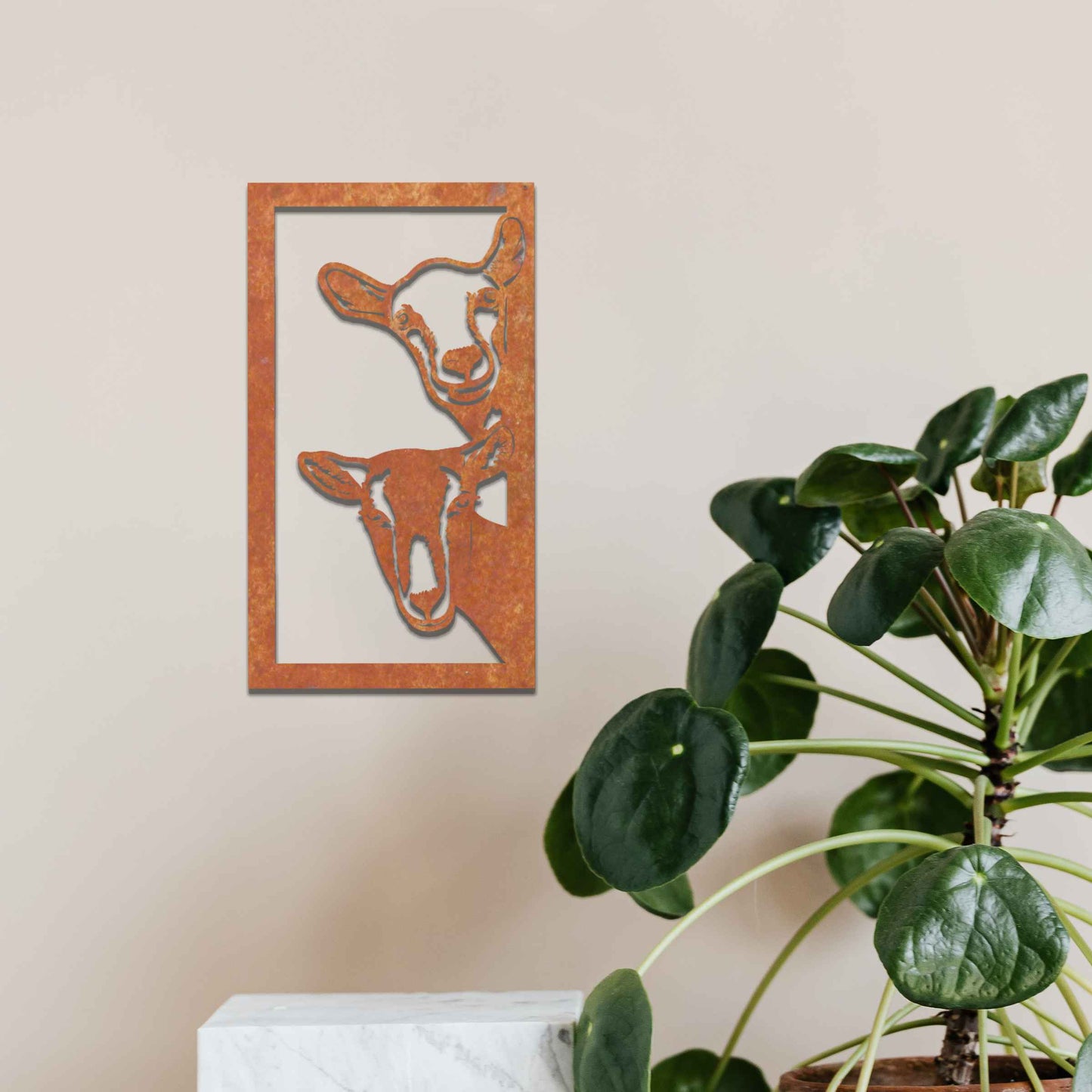 A striking design showcasing the faces of two goats, framed in a vertical panel. The detailed depiction of their expressions brings a unique charm to this modern, rustic wall art piece.