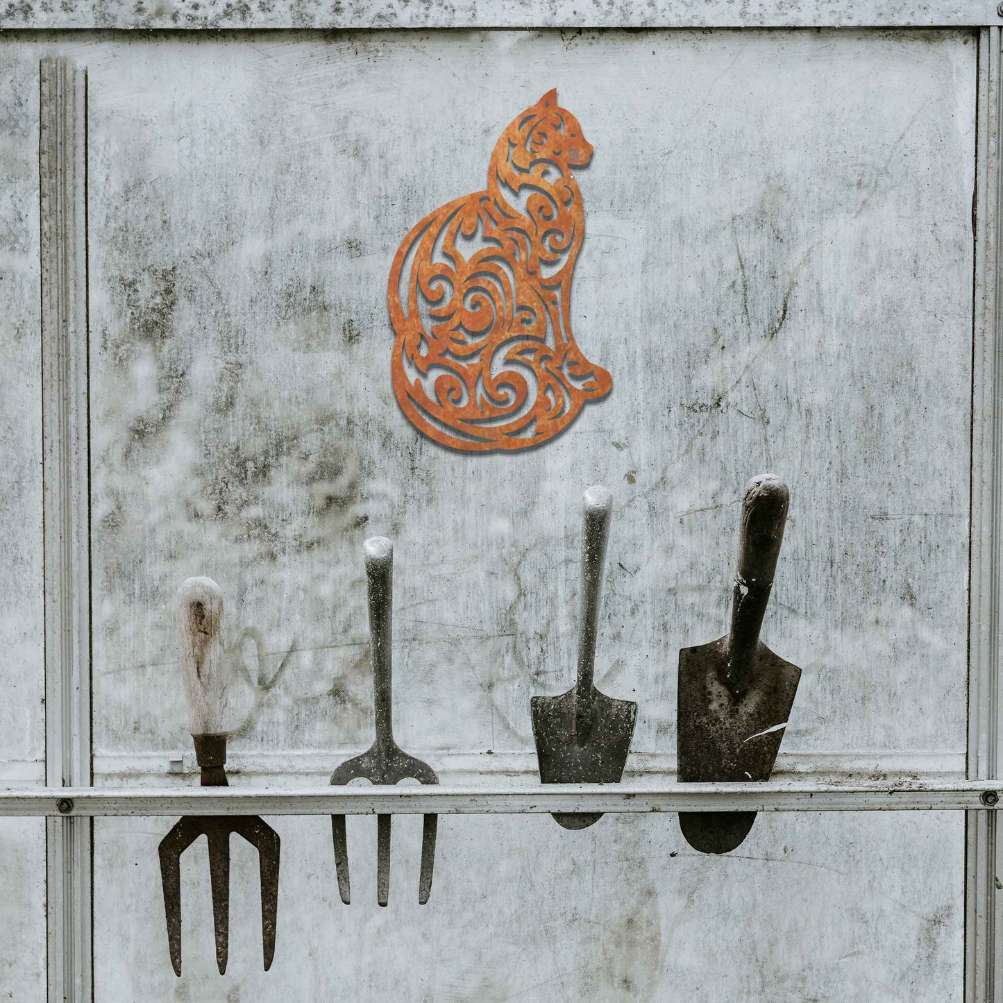 This design features a silhouette of a cat in profile, its body adorned with intricate swirls and patterns. The cat sits gracefully, showcasing elegant detailing throughout the design.