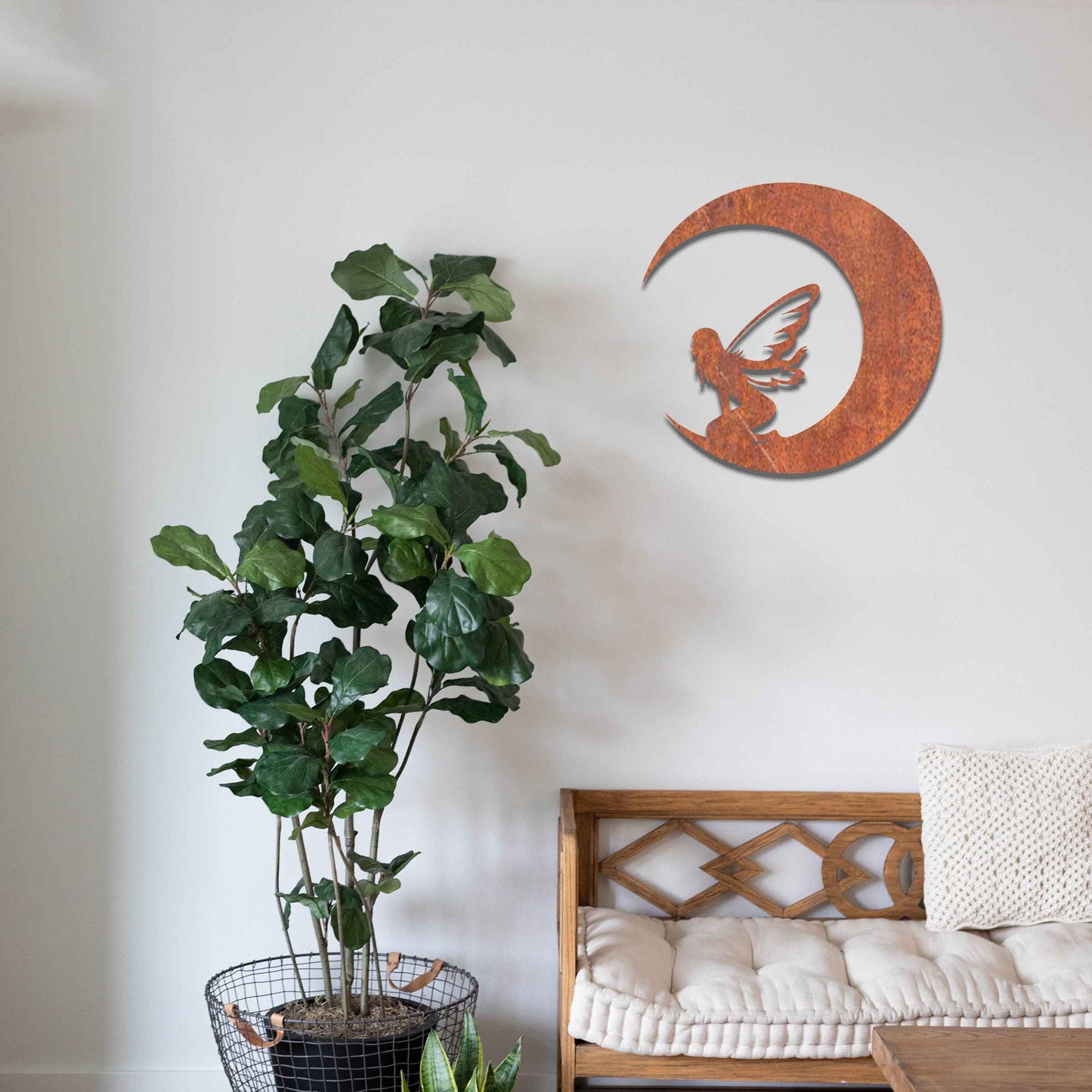 This design showcases a fairy sitting within the curve of a crescent moon, adding a mystical touch with delicate wings. The flowing, simple lines of the crescent and the fairy's posture create a peaceful, ethereal feeling, perfect for enhancing a serene space.