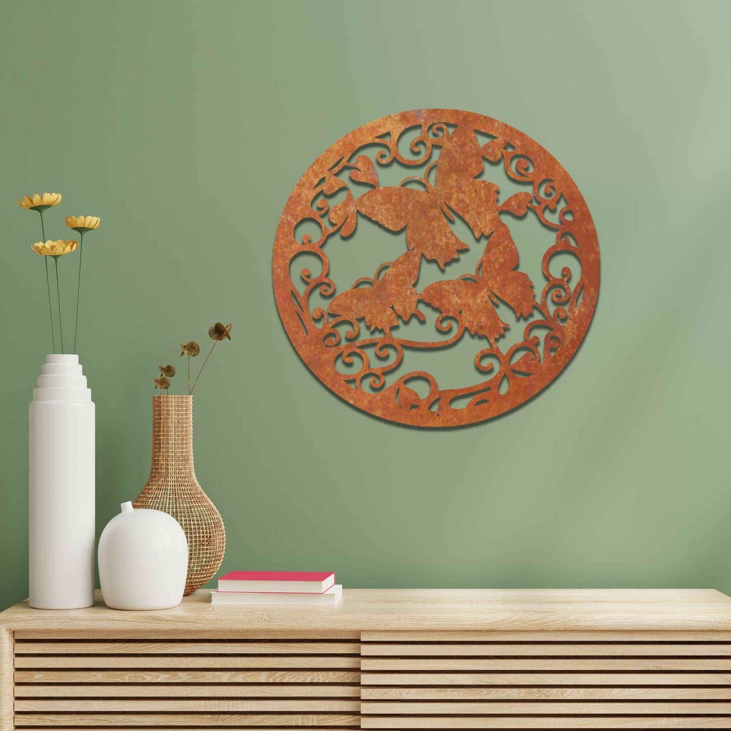 Metal garden decoration featuring a circular design with intricate butterflies and swirling vine patterns, adding a touch of elegance and nature-inspired artistry to outdoor or indoor spaces.