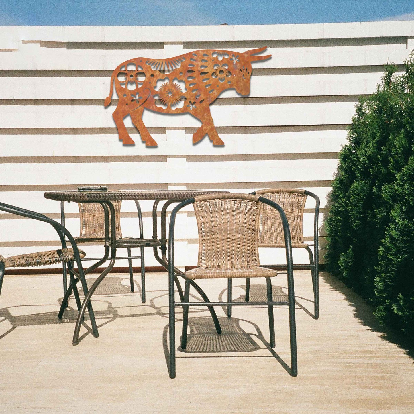 The design showcases a bull adorned with intricate floral patterns, blending natural strength with delicate details. The bold shape of the bull is enhanced by the flower motifs, giving it a unique and artistic appearance.