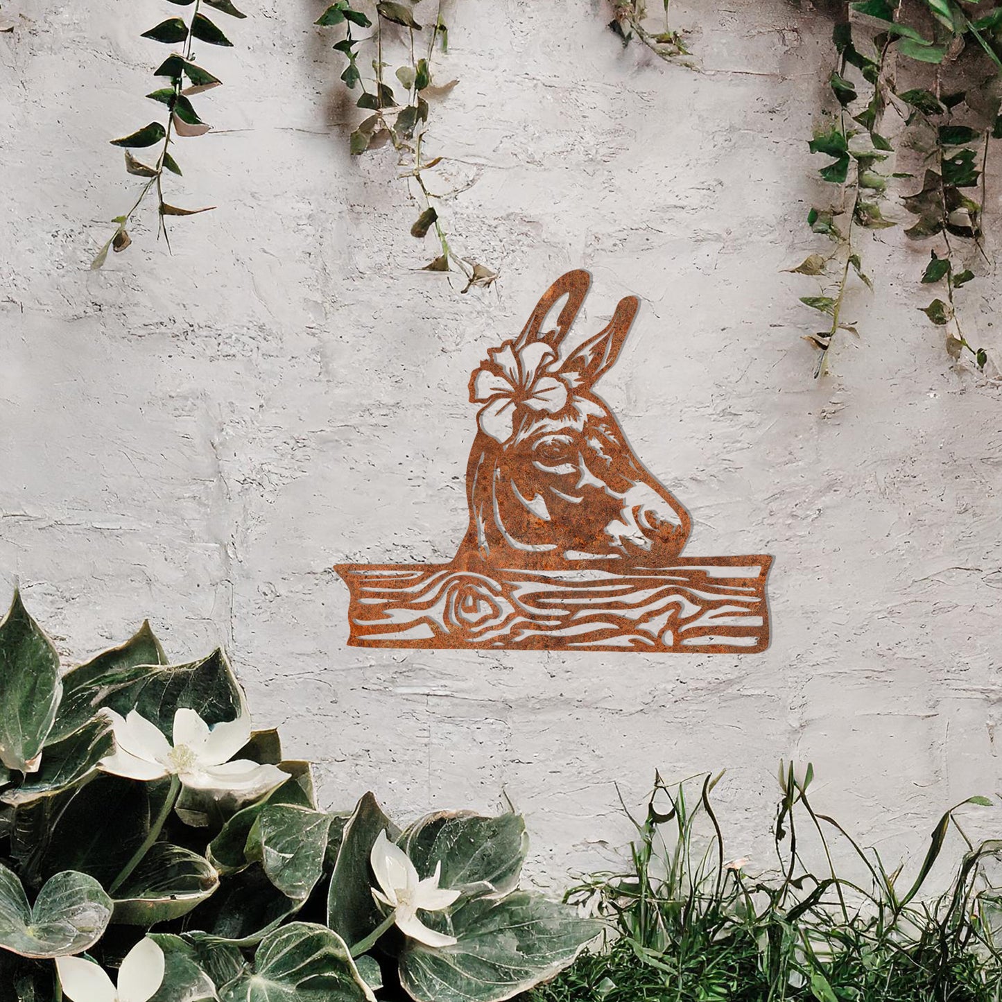 This wall art design showcases a beautifully detailed donkey head adorned with a flower, resting atop a wooden plank-like base. A charming and rustic piece perfect for farmhouse decor or animal enthusiasts.