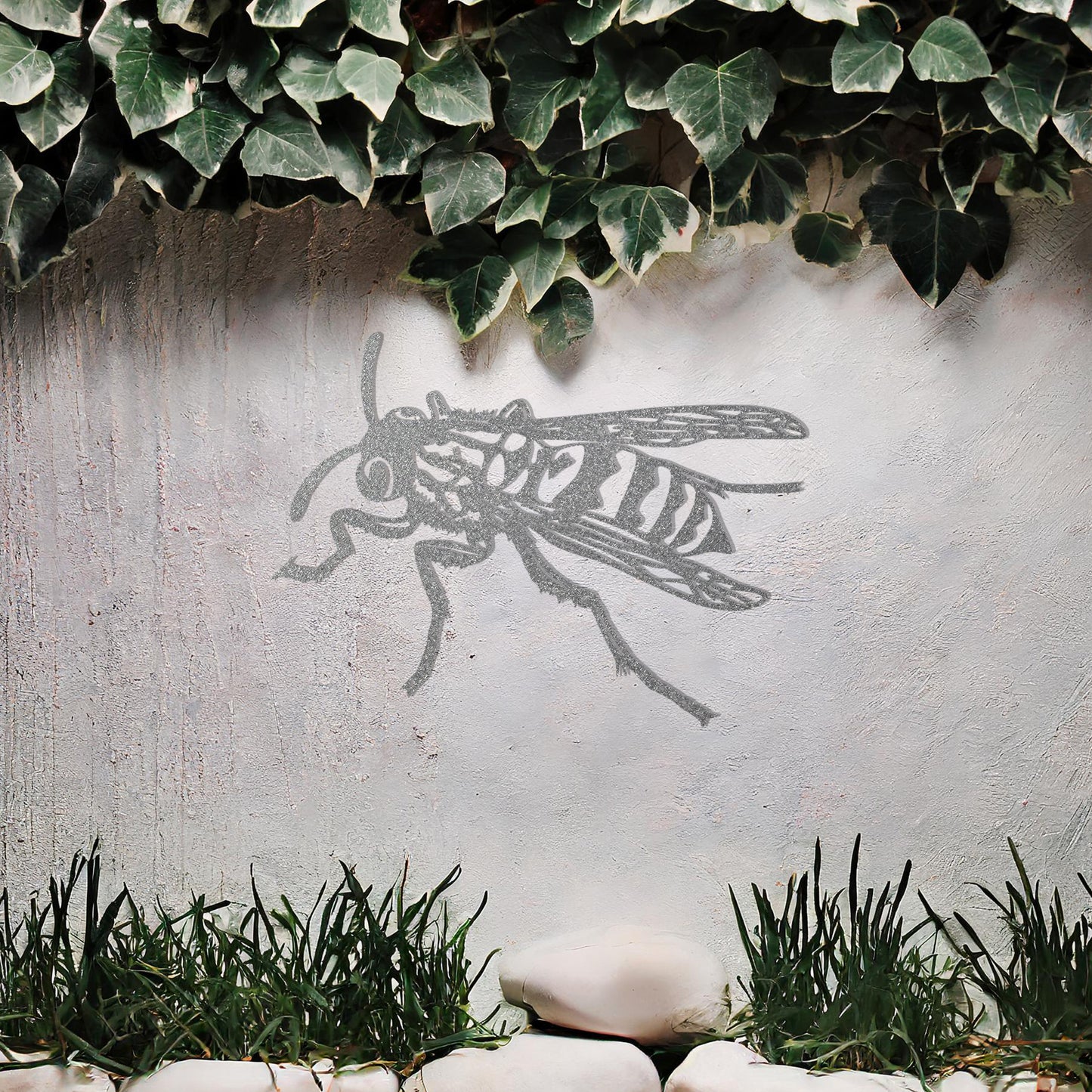 The design features a highly detailed wasp in mid-flight, showcasing intricate lines and patterns on its body and wings. The artwork is displayed above a tranquil water feature, highlighting the insect’s dynamic form.