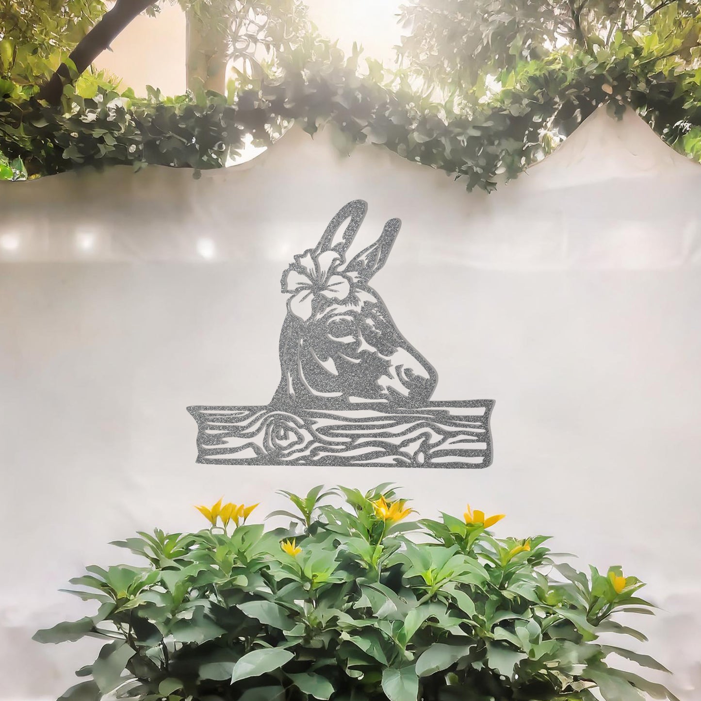This wall art design showcases a beautifully detailed donkey head adorned with a flower, resting atop a wooden plank-like base. A charming and rustic piece perfect for farmhouse decor or animal enthusiasts.