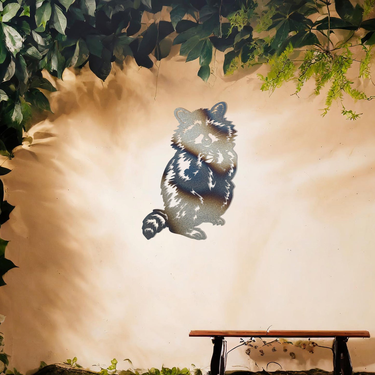 A metal wall art piece featuring a detailed raccoon design, evoking charm and playfulness. This adorable artwork adds a whimsical touch to modern or rustic settings, harmonising beautifully with natural decor elements.