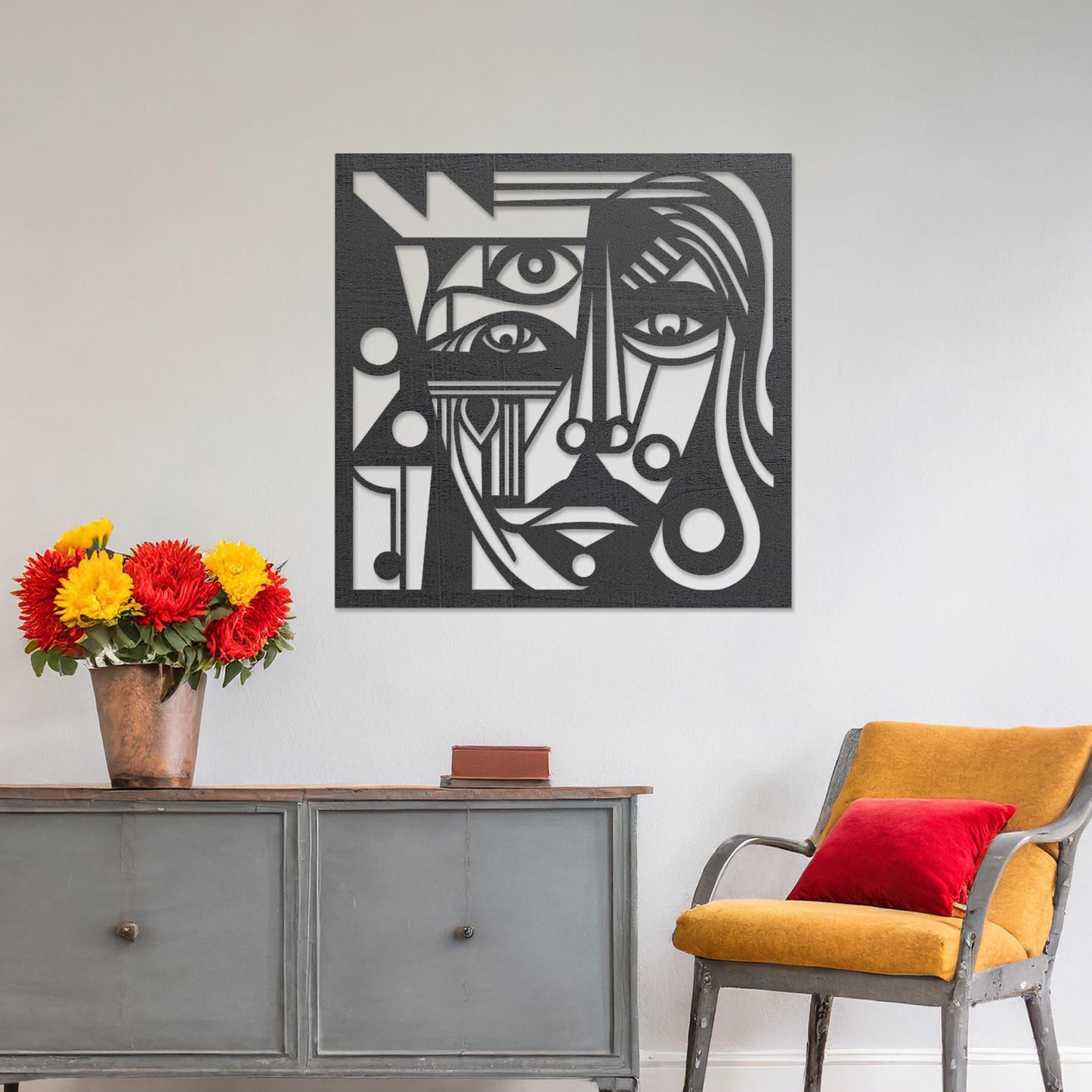 Wall art featuring an abstract face design with intricate geometric patterns and bold linework. The piece is displayed on a neutral wall within modern decor, adding a striking and artistic focal point to the space.