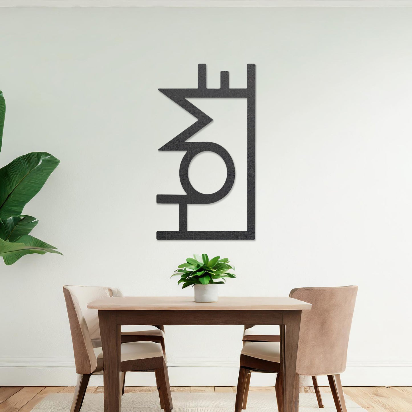 Wall art featuring the word "HOME" in a bold, modern design with geometric shapes integrated into the lettering. The piece is displayed on a neutral wall within contemporary room decor, adding a stylish and welcoming touch to the space.