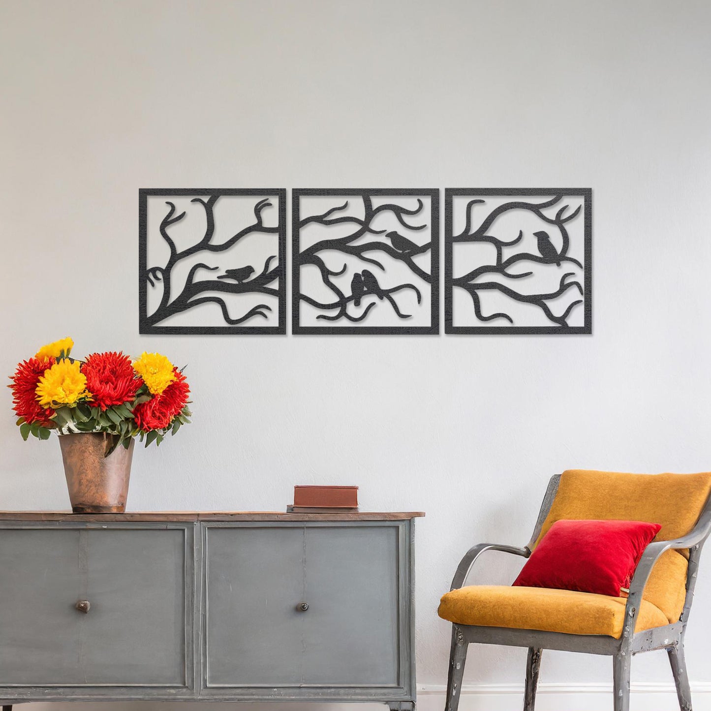 A three-panel wall art showcasing a design of birds perched on delicate tree branches. The intricate artwork is displayed on a neutral wall in a modern room, enhancing the natural and elegant ambiance of the decor.