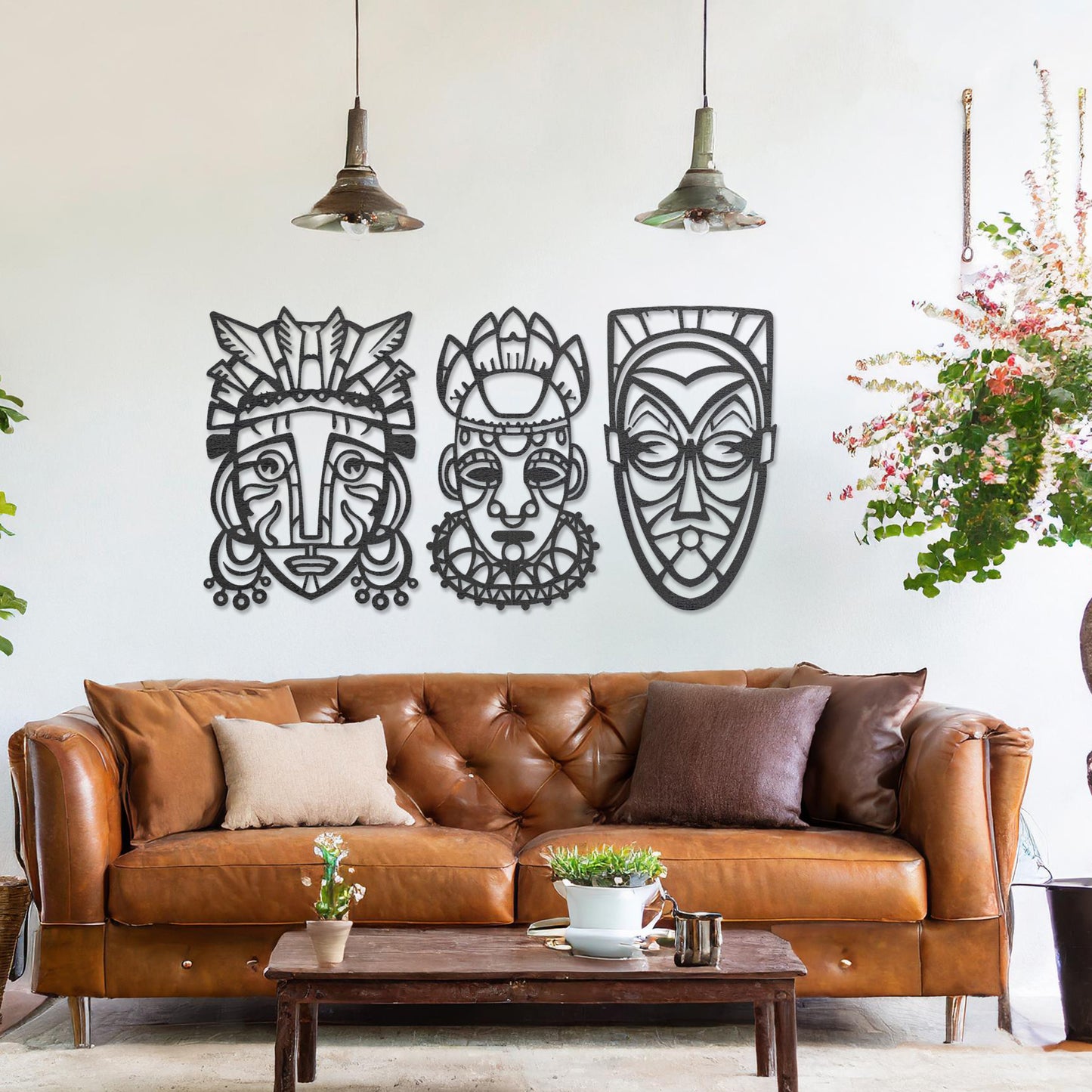 This is a wall art design featuring three tribal masks with intricate details, displayed on a neutral wall. The masks' features and patterns create an eye-catching, cultural focal point, enhancing the modern room's decor.