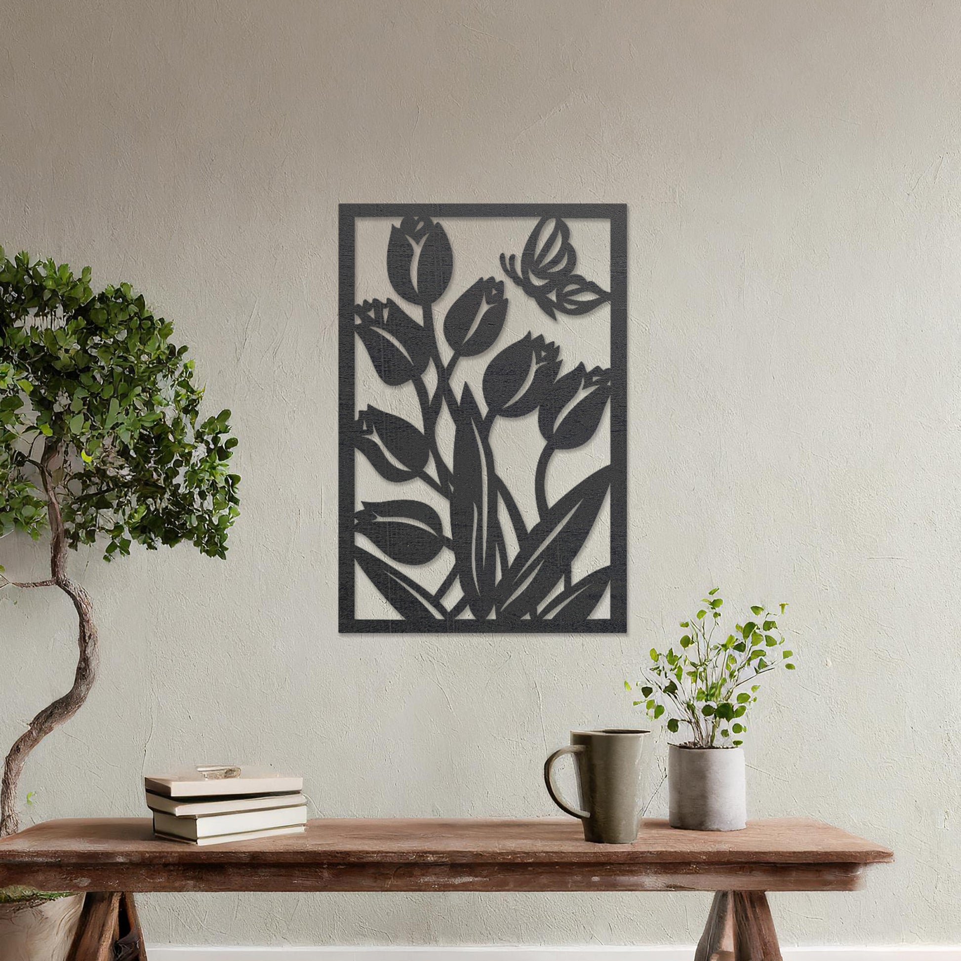 Wooden wall art design featuring tulips with a butterfly, framed in a rectangular shape, placed on a neutral wall within modern room decor. The design captures the beauty of nature with detailed plant and insect motifs.