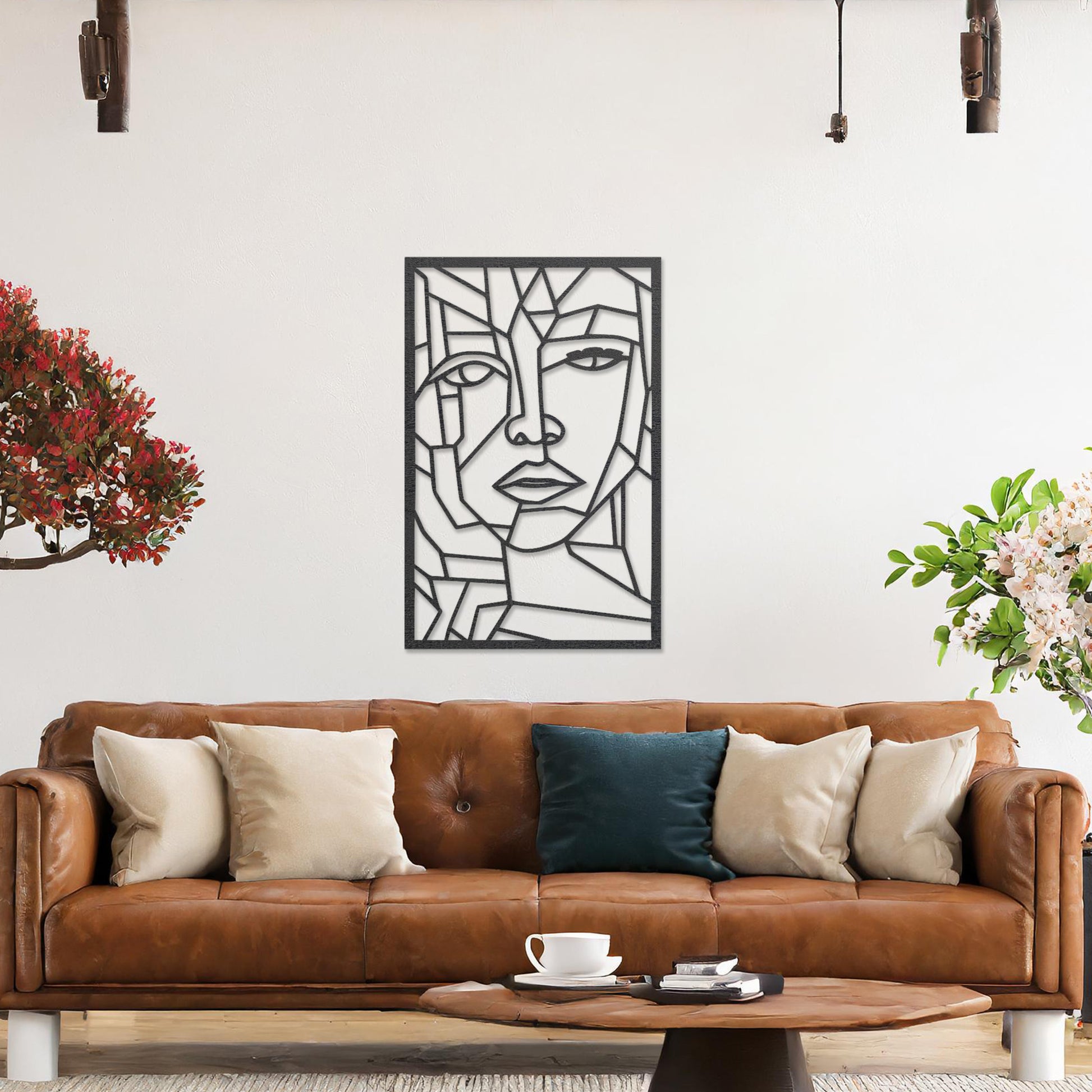Wall art featuring a geometric abstract face design with sharp angular lines forming a modern and artistic composition. The piece is displayed on a neutral wall within contemporary decor, adding a bold and creative focal point to the space.