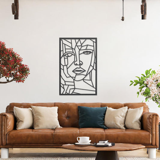Wall art featuring a geometric abstract face design with sharp angular lines forming a modern and artistic composition. The piece is displayed on a neutral wall within contemporary decor, adding a bold and creative focal point to the space.