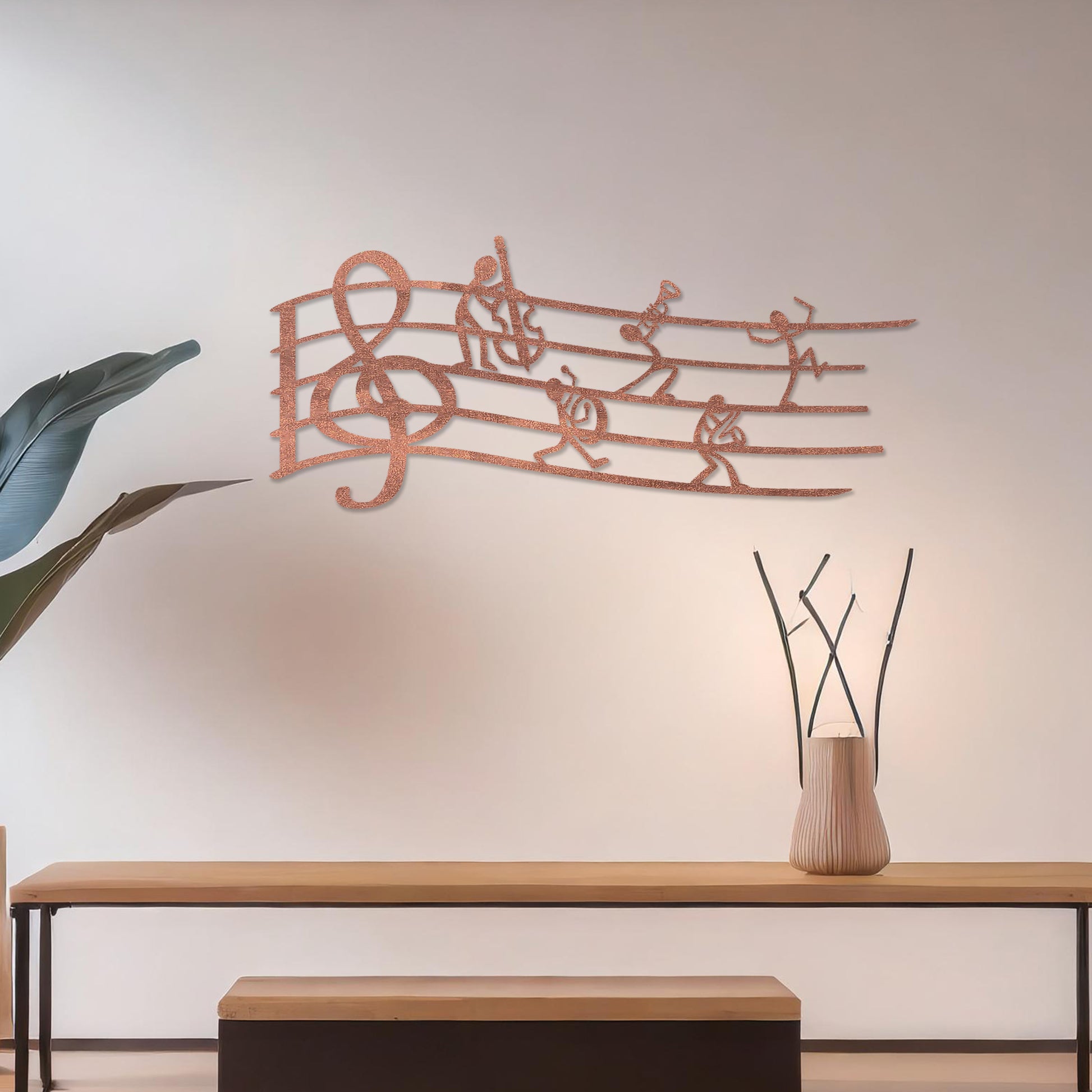 Wall art featuring a creative design of a musical staff with a treble clef and stick figures playing instruments, adding a whimsical and artistic touch. The piece is displayed on a neutral wall within modern decor, enhancing the space with musical charm.