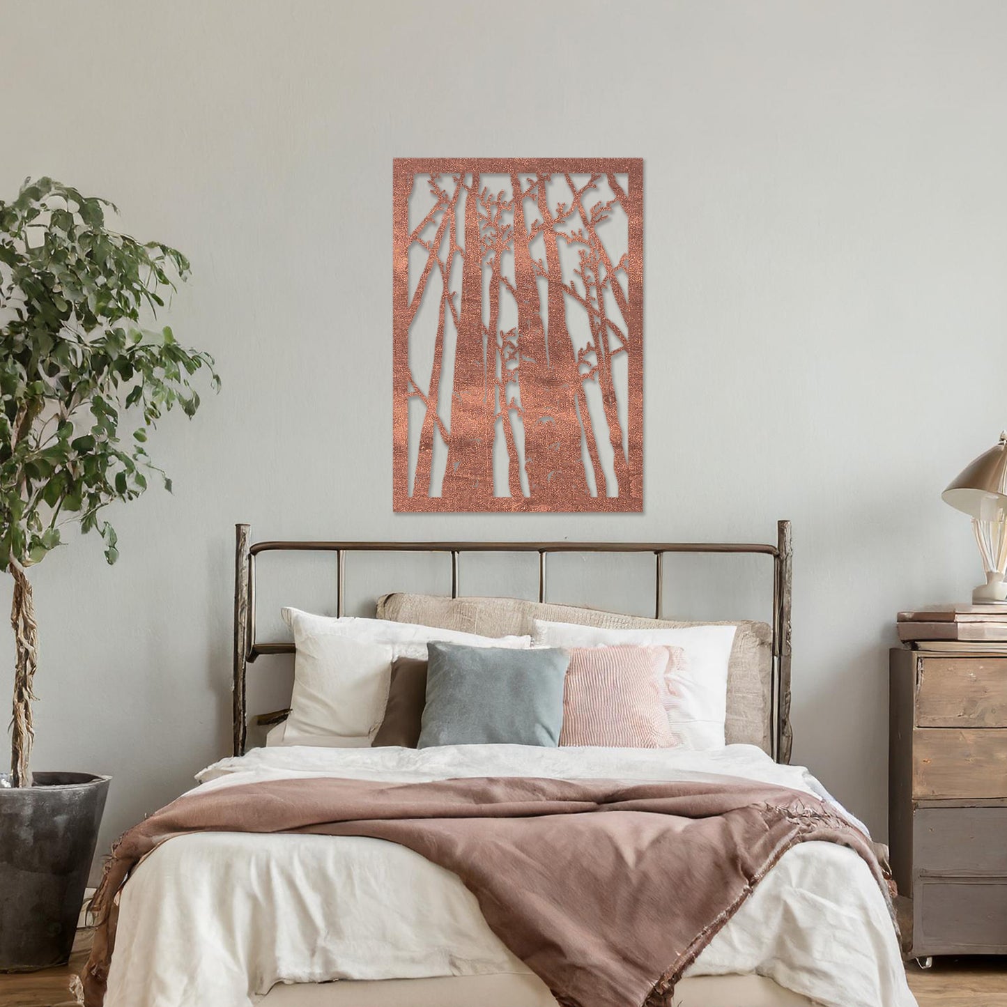 Wooden wall art featuring a forest design with tall, slender trees and intricate branches, displayed on a neutral wall within modern room decor, showcasing its natural and artistic craftsmanship.