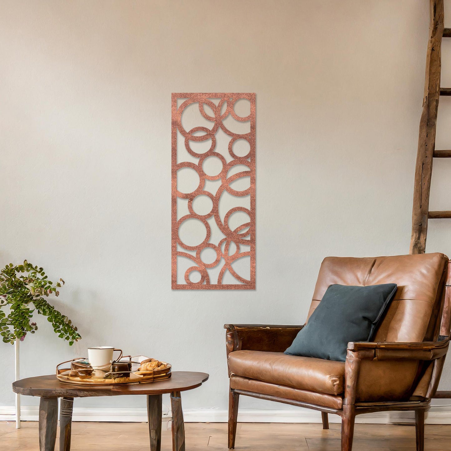 A rectangular wall art piece featuring an abstract design of overlapping circles of various sizes. The artwork is displayed on a neutral wall in a modern room,