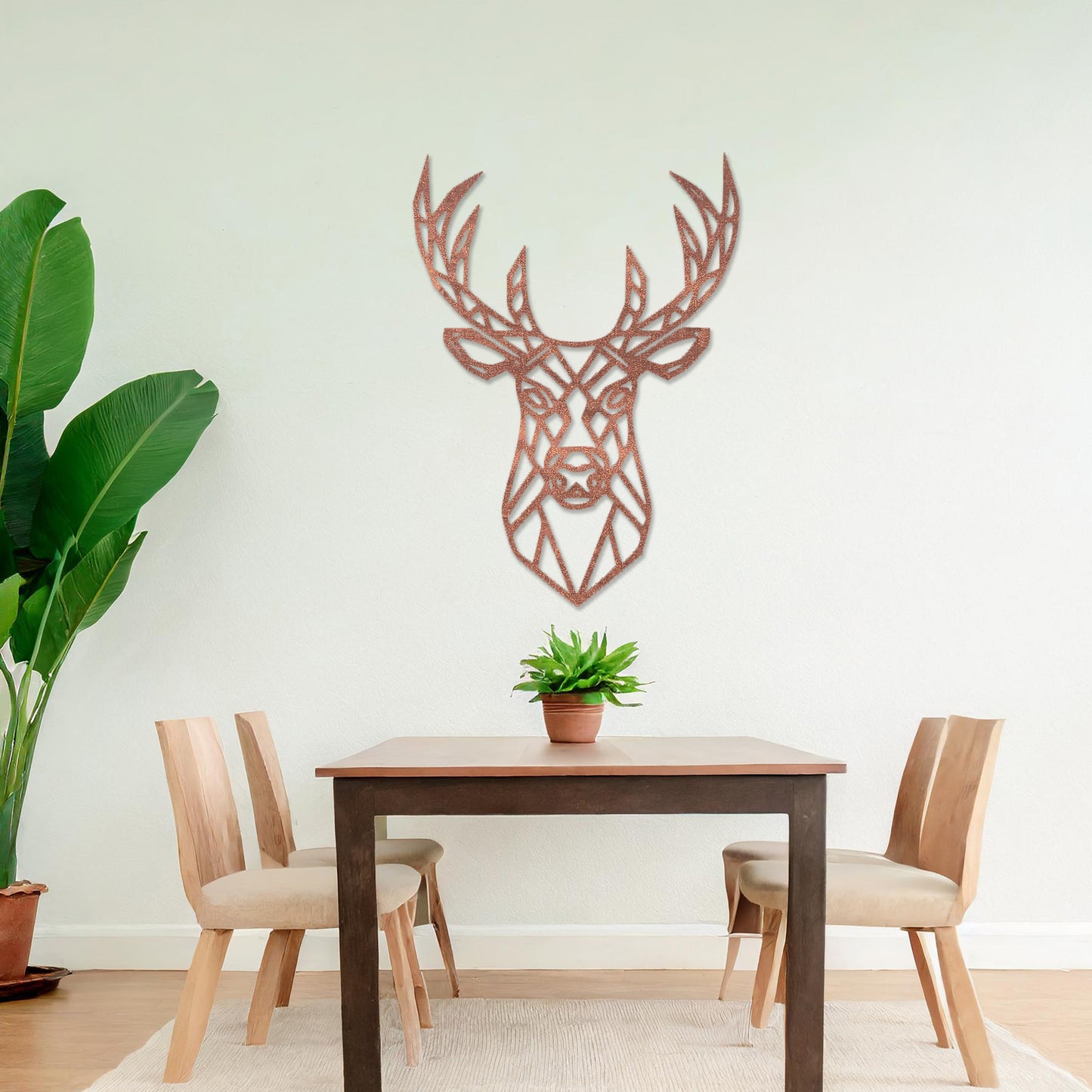 Wooden wall art featuring a geometric deer head design with intricate antlers, displayed on a neutral wall within modern room decor, showcasing its bold and contemporary artistic style.