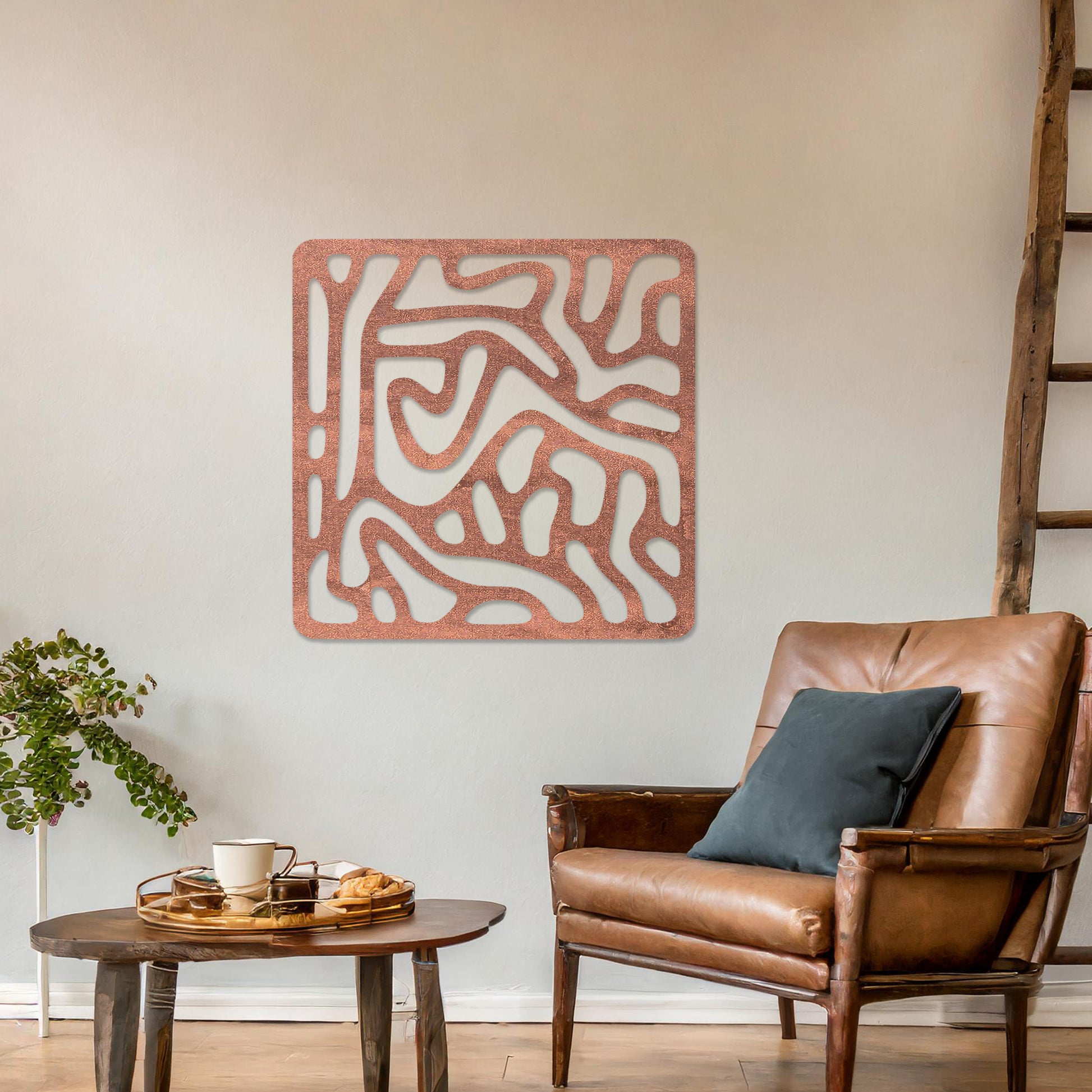Wall art featuring an abstract design with flowing, interconnected organic shapes forming a bold pattern. The piece is displayed on a neutral wall within modern decor, adding a contemporary and artistic touch to the space.
