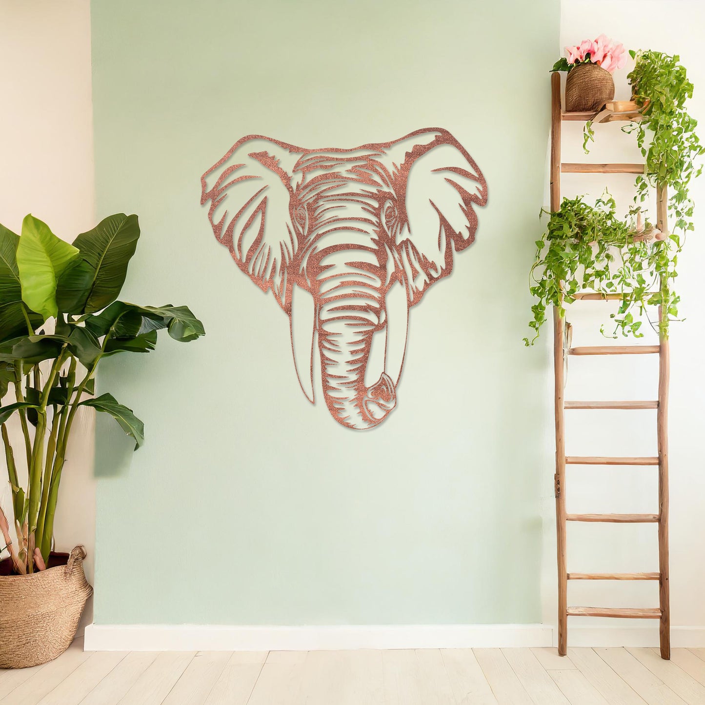Wooden wall art featuring an intricately detailed elephant head design, displayed on a neutral wall within modern room decor, highlighting its bold and artistic craftsmanship.