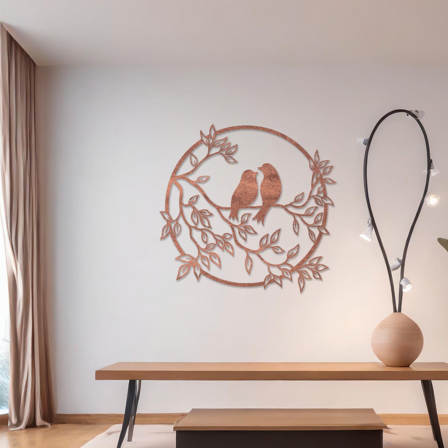 Wooden wall art featuring a circular design with two birds perched on a branch surrounded by leaves, displayed on a neutral wall within modern room decor, showcasing its delicate and nature-inspired craftsmanship.