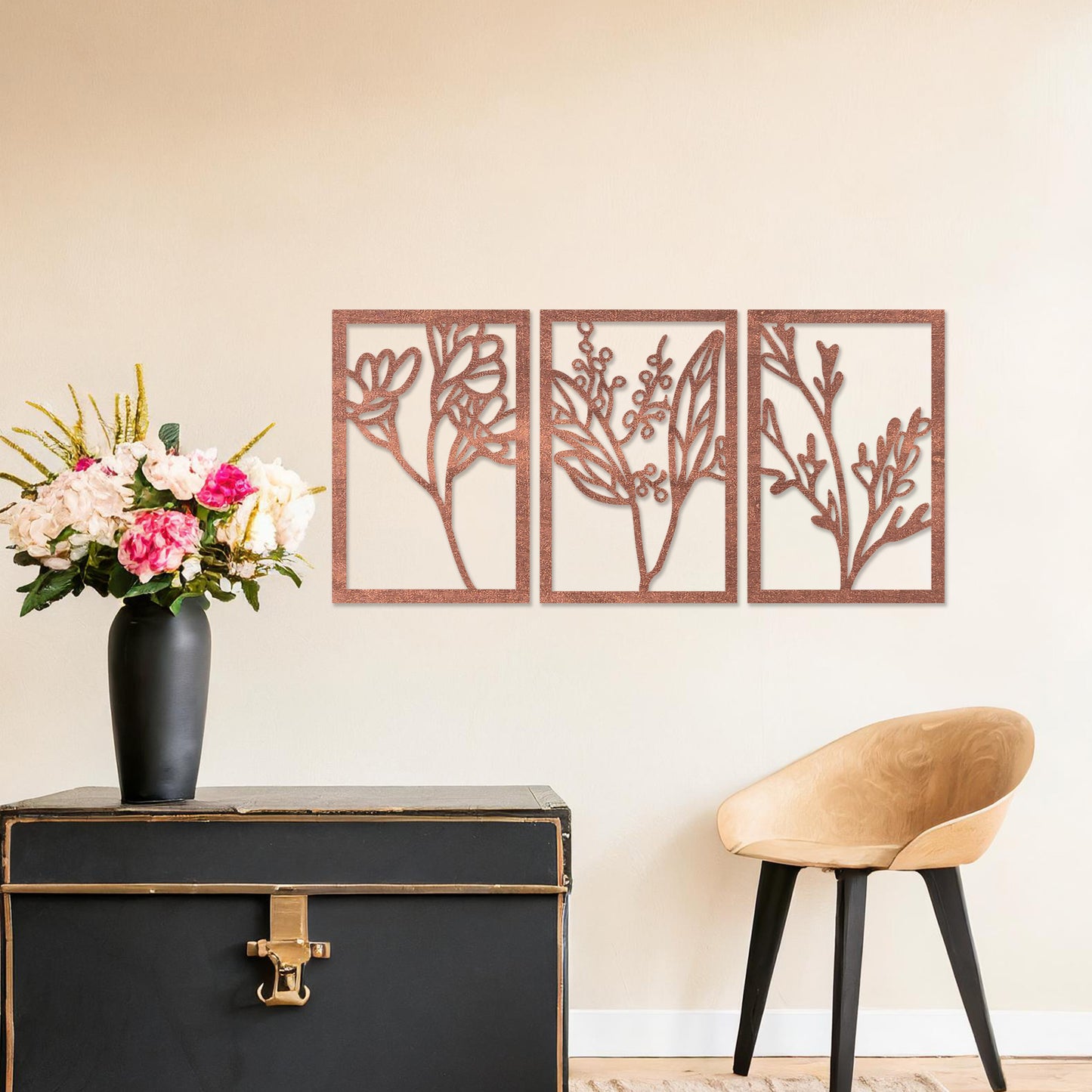 Wall art featuring a triptych of minimalist botanical designs, each panel highlighting delicate stems, leaves, and berries. The artwork is displayed on a neutral wall within modern decor, adding a subtle and natural elegance to the space.