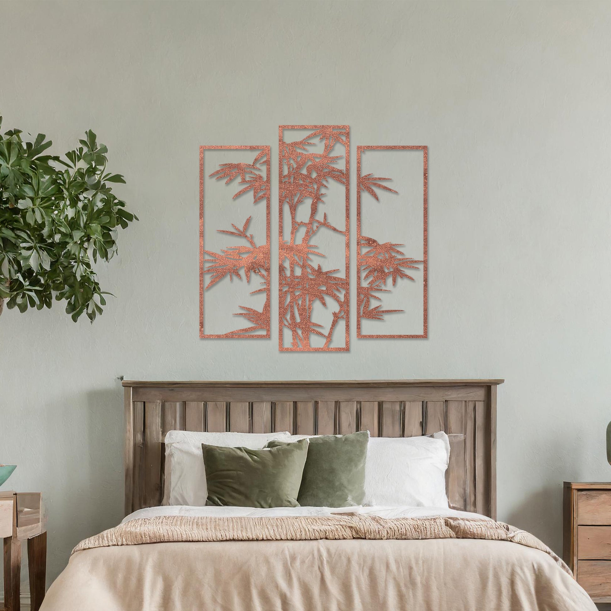 Wooden wall art consisting of three panels featuring a bamboo design with detailed leaves and stalks, displayed on a neutral wall within modern room decor, highlighting its elegant and nature-inspired craftsmanship.