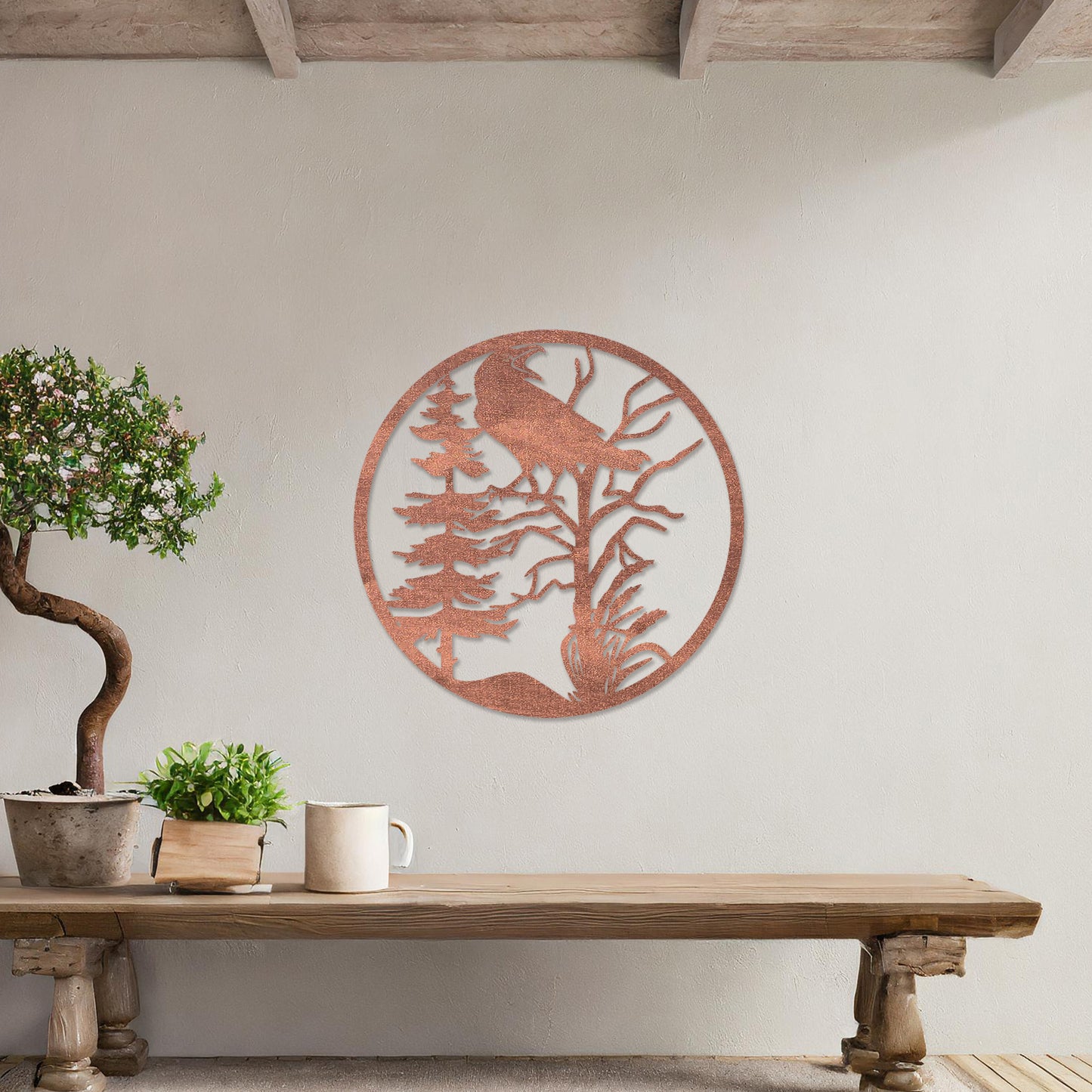 Wooden wall art featuring a circular design with a silhouette of a bird perched on a tree surrounded by natural elements. The artwork is displayed on a neutral wall within modern room decor, highlighting its rustic and nature-inspired design.