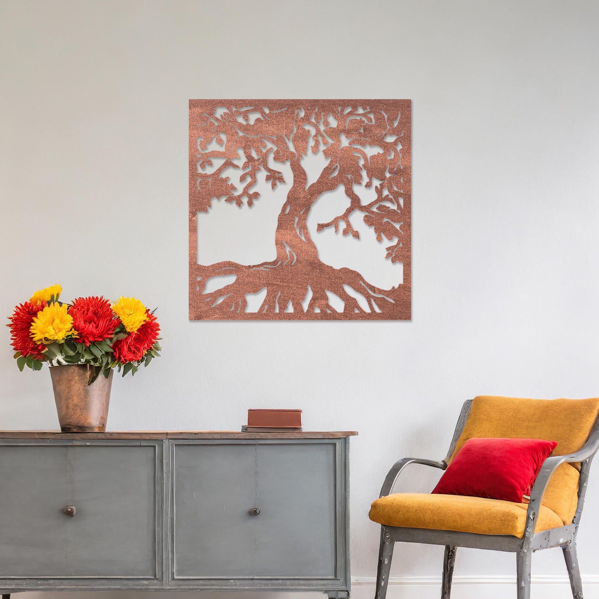 Wall art featuring a detailed tree of life design with sprawling branches and roots, symbolising growth and connection. The piece is displayed on a neutral wall within rustic-modern decor, adding a natural and meaningful focal point to the space.
