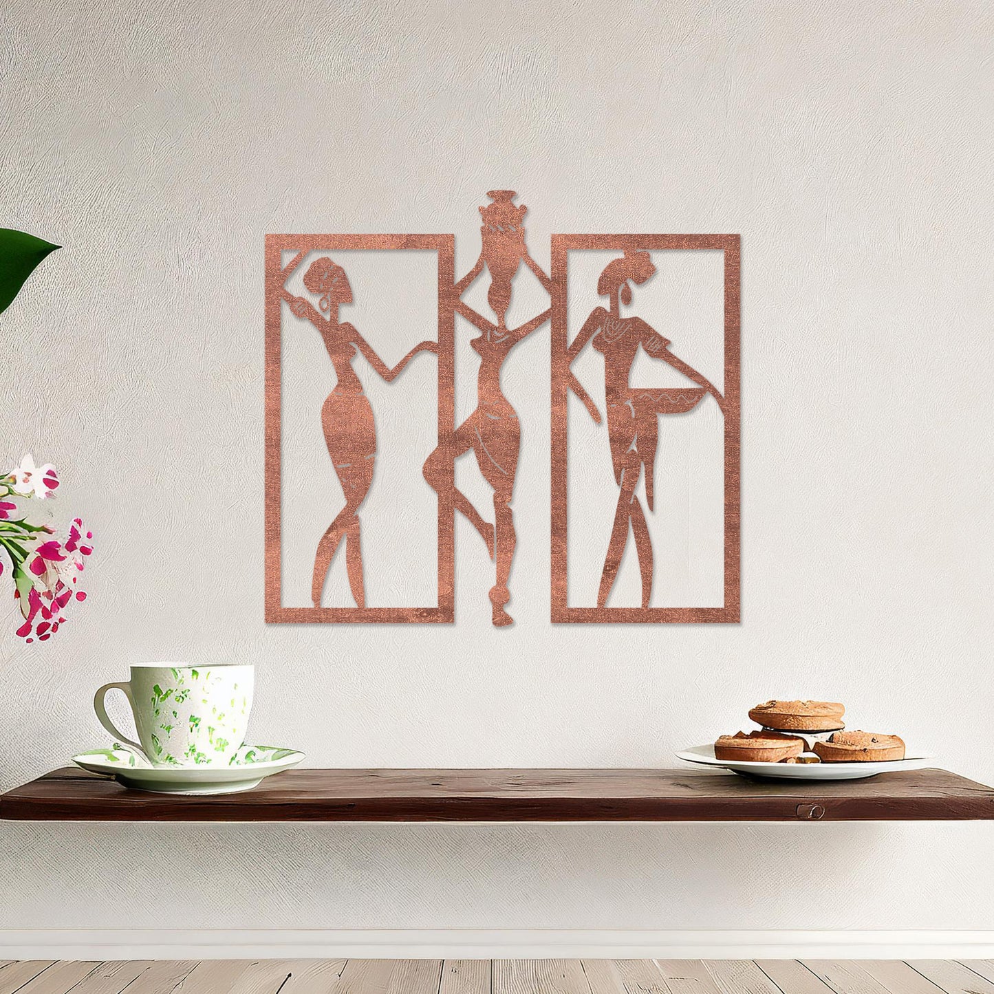 Wall art featuring a triptych design of abstract figures in dynamic poses, framed within rectangular panels. The artwork is displayed on a neutral wall within modern decor, adding an artistic and cultural touch to the space.