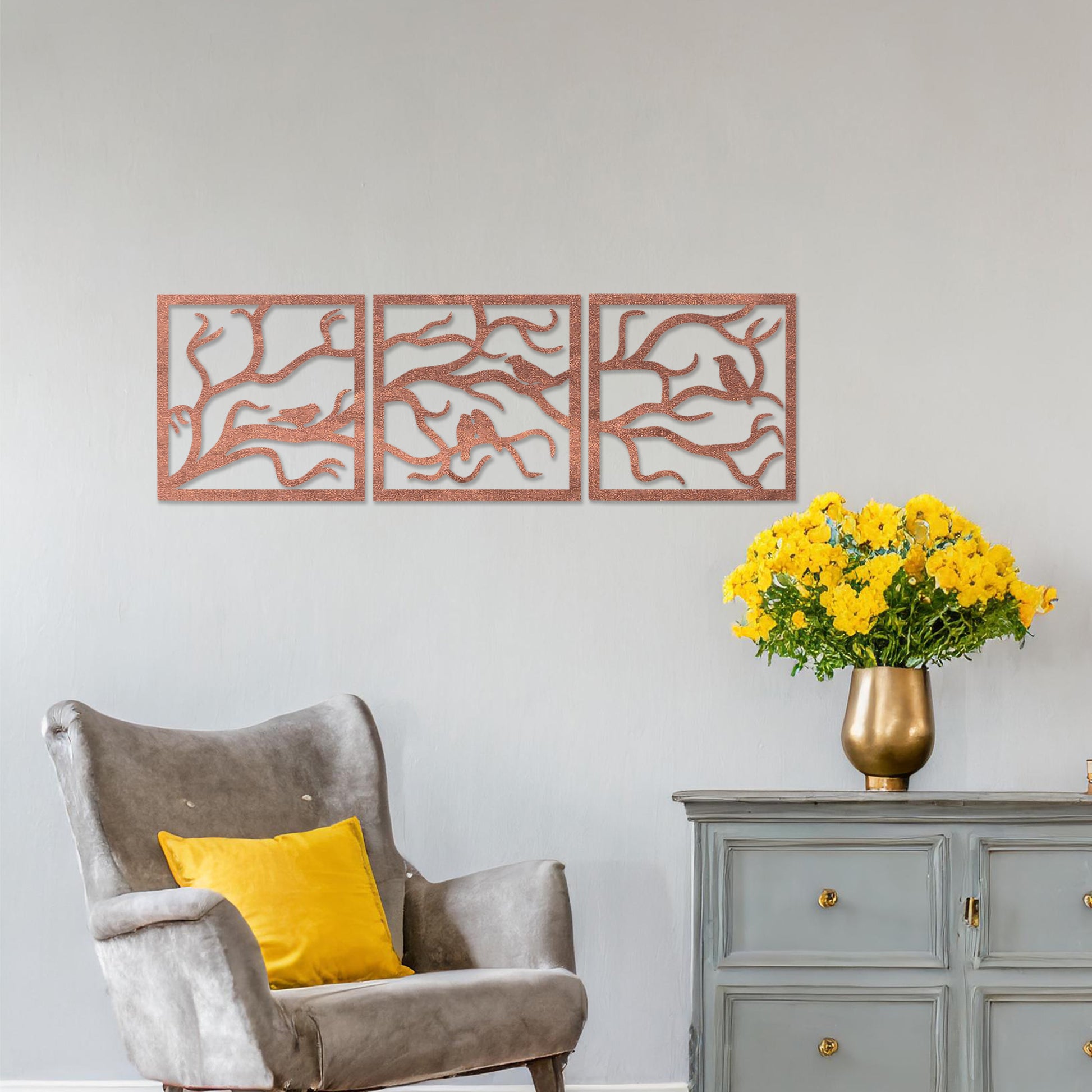 A three-panel wall art showcasing a design of birds perched on delicate tree branches. The intricate artwork is displayed on a neutral wall in a modern room, enhancing the natural and elegant ambiance of the decor.