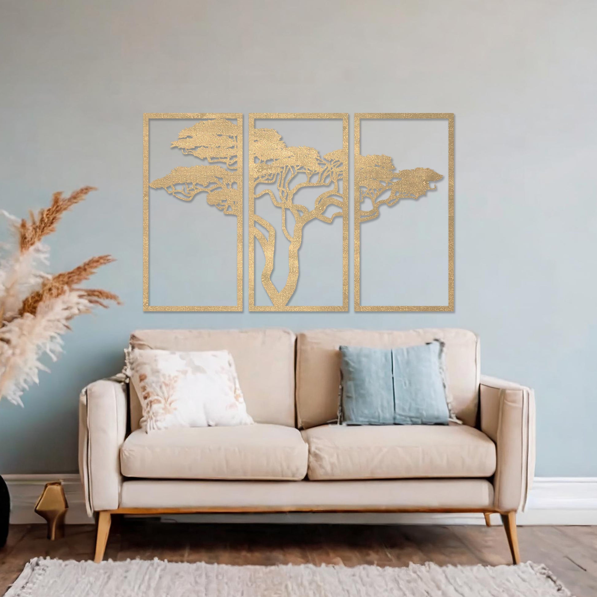 Three-panel wooden wall art featuring an elegant silhouette of a tree with spreading branches, displayed on a neutral wall within modern room decor. The intricate design adds depth and sophistication to the space.