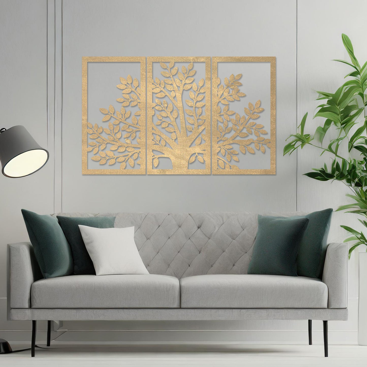 Wooden wall art comprising three panels featuring a tree design with detailed leaves and branches, displayed on a neutral wall within modern room decor, showcasing its intricate and natural craftsmanship.