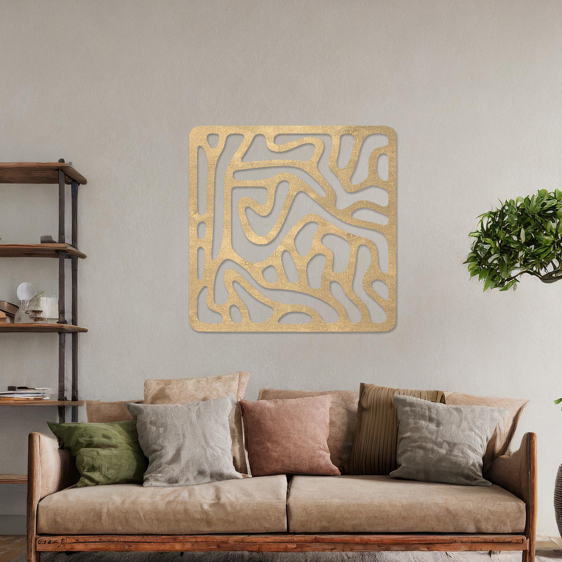 Wall art featuring an abstract design with flowing, interconnected organic shapes forming a bold pattern. The piece is displayed on a neutral wall within modern decor, adding a contemporary and artistic touch to the space.