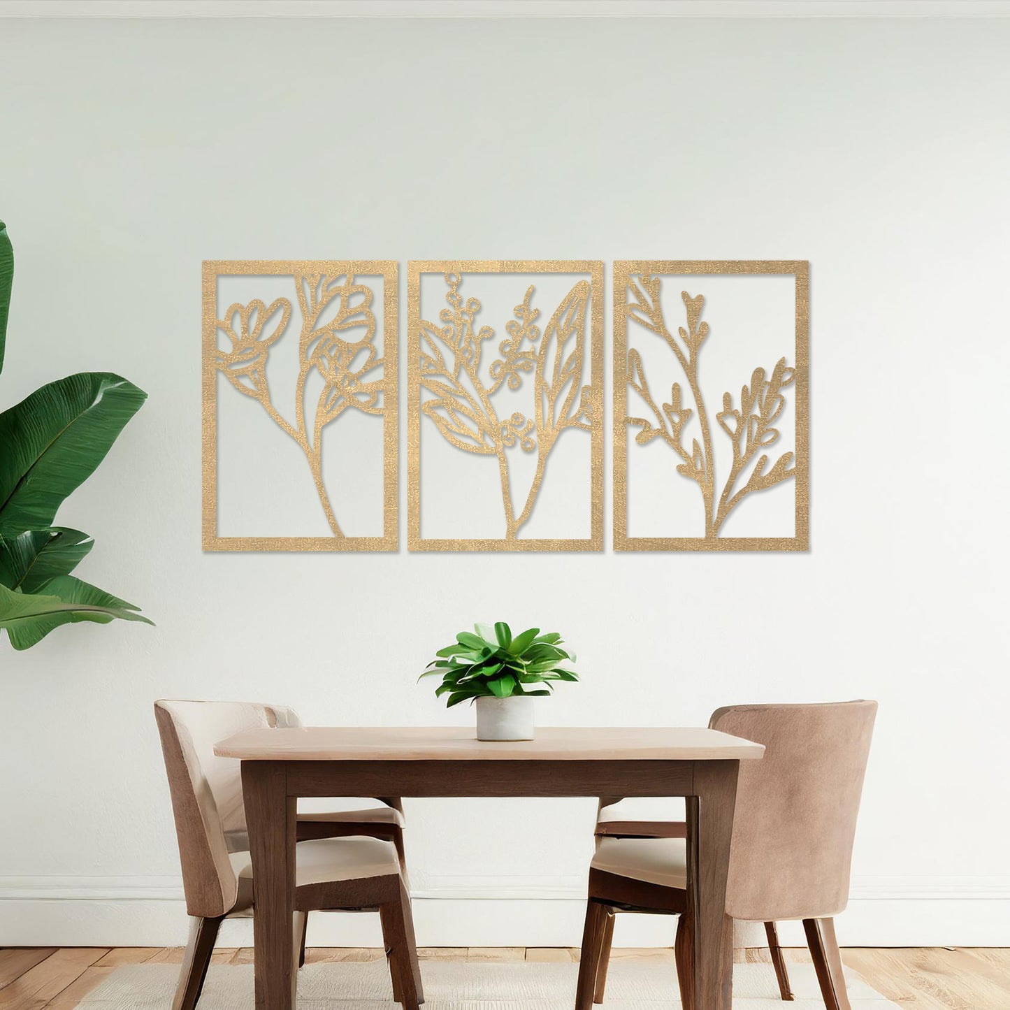 Wall art featuring a triptych of minimalist botanical designs, each panel highlighting delicate stems, leaves, and berries. The artwork is displayed on a neutral wall within modern decor, adding a subtle and natural elegance to the space.