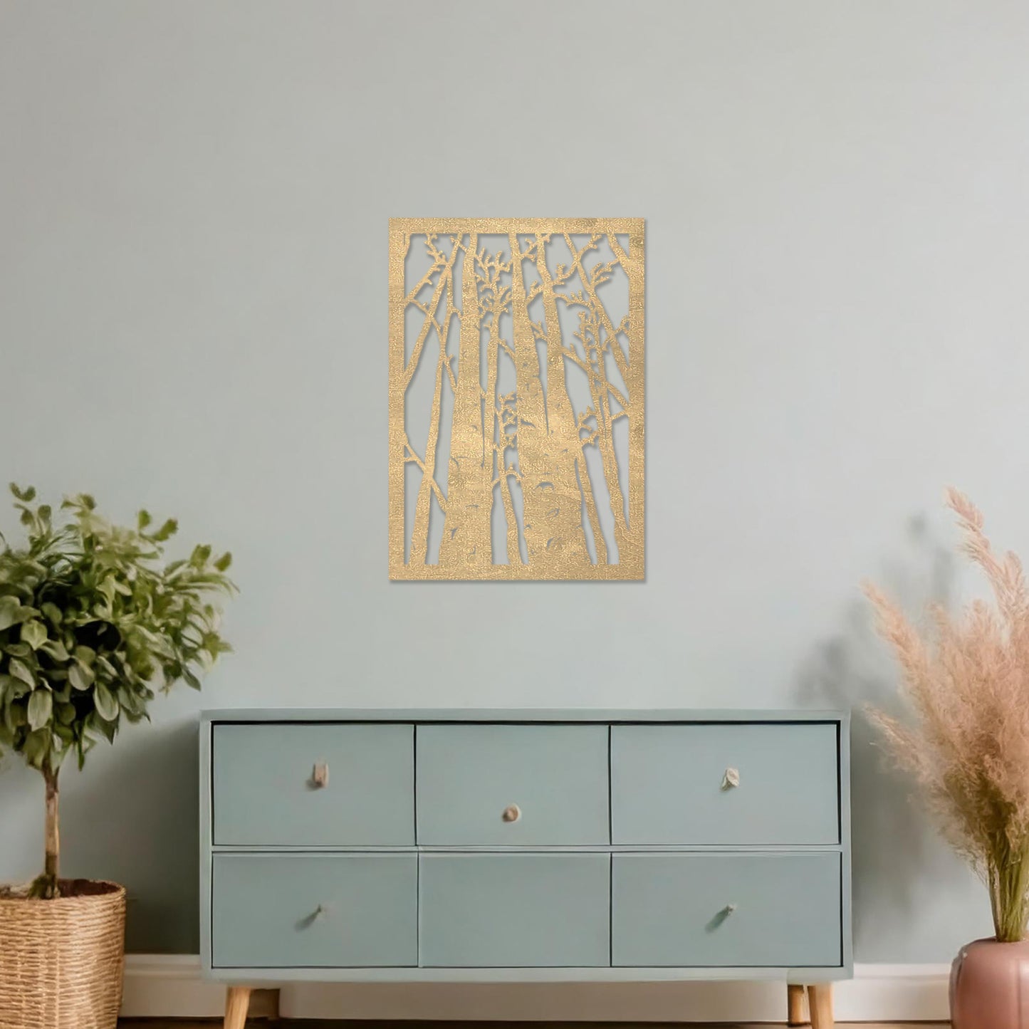 Wooden wall art featuring a forest design with tall, slender trees and intricate branches, displayed on a neutral wall within modern room decor, showcasing its natural and artistic craftsmanship.