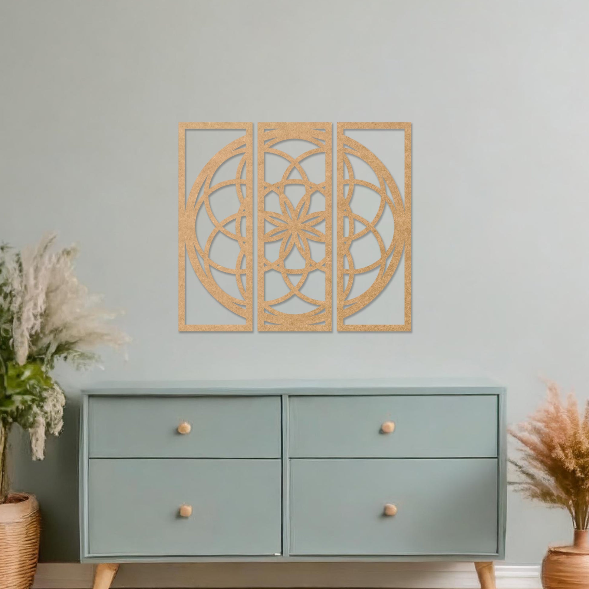 Wall art featuring a triptych design with an intricate geometric pattern of interlocking circles and floral elements. The artwork is displayed on a neutral wall within modern decor, adding a balanced and artistic focal point to the space.