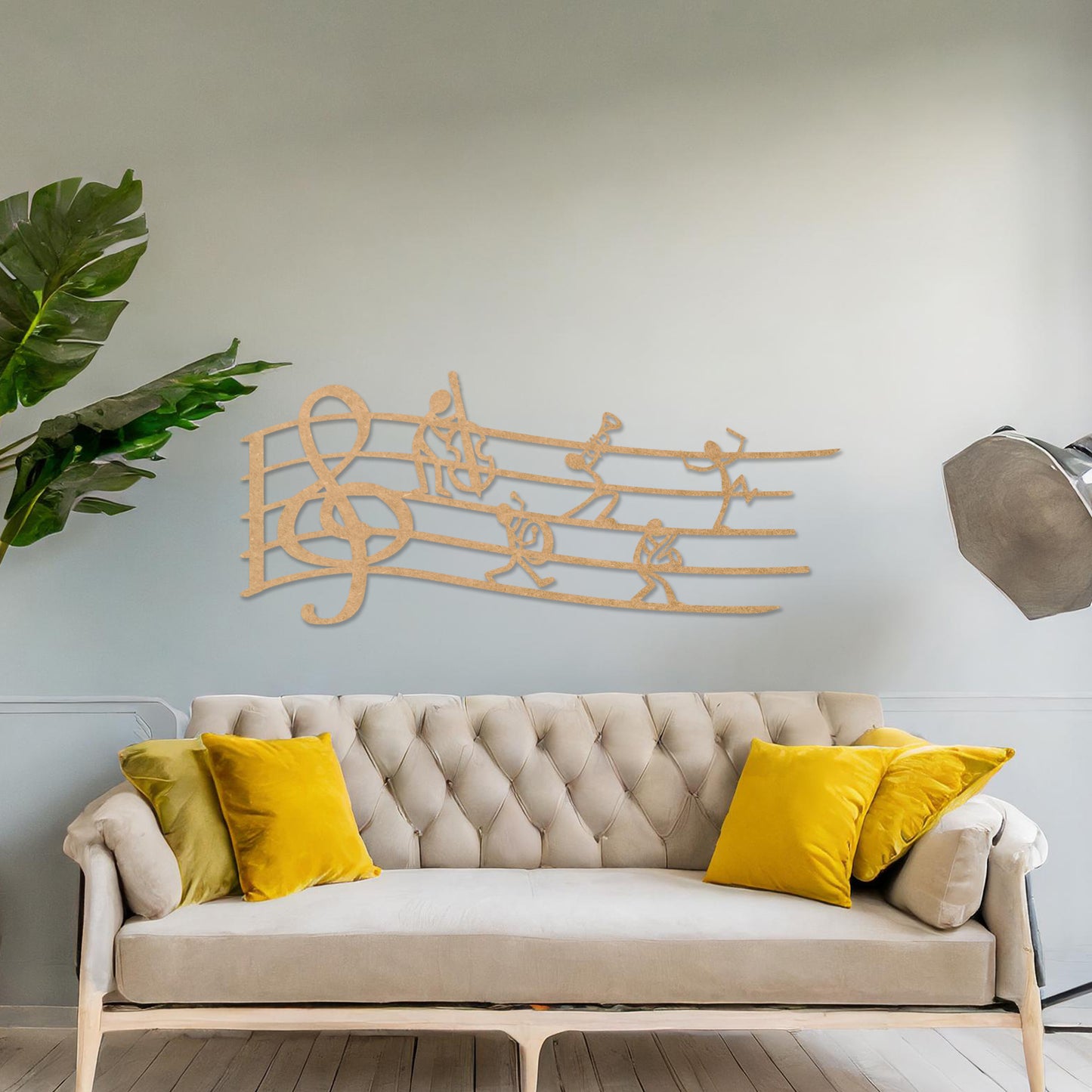 Wall art featuring a creative design of a musical staff with a treble clef and stick figures playing instruments, adding a whimsical and artistic touch. The piece is displayed on a neutral wall within modern decor, enhancing the space with musical charm.