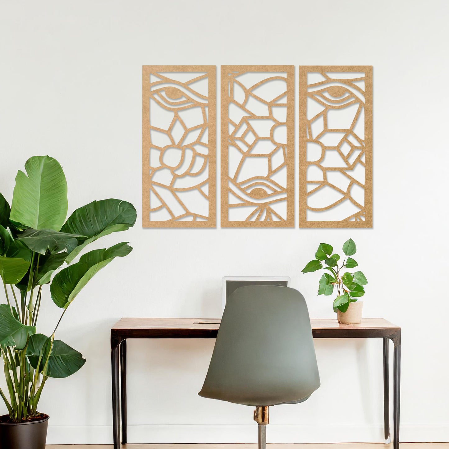 Wooden wall art featuring a three-panel abstract design with geometric shapes and eye motifs. The artwork is displayed on a neutral wall within modern room decor, showcasing its intricate and unique pattern.