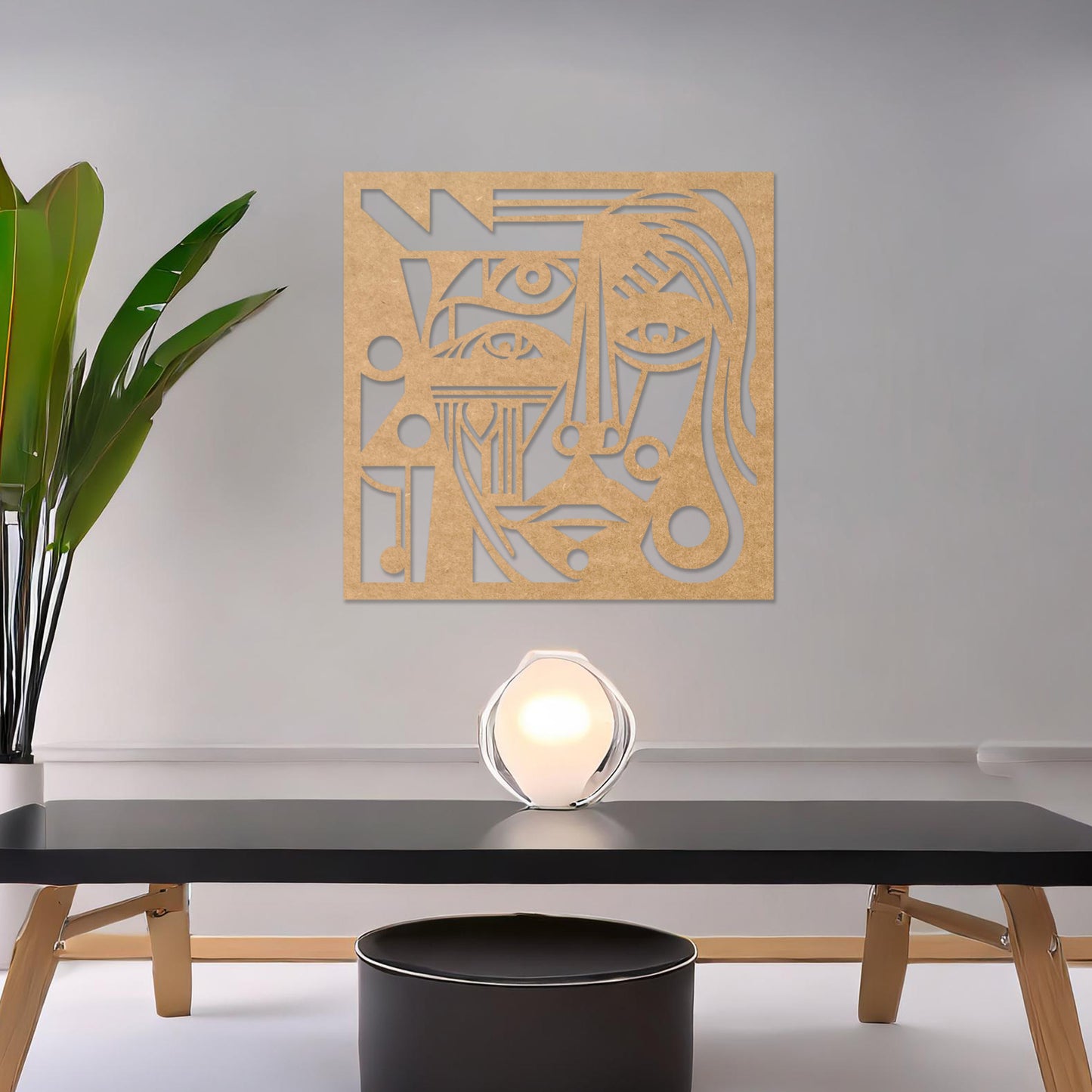 Wall art featuring an abstract face design with intricate geometric patterns and bold linework. The piece is displayed on a neutral wall within modern decor, adding a striking and artistic focal point to the space.