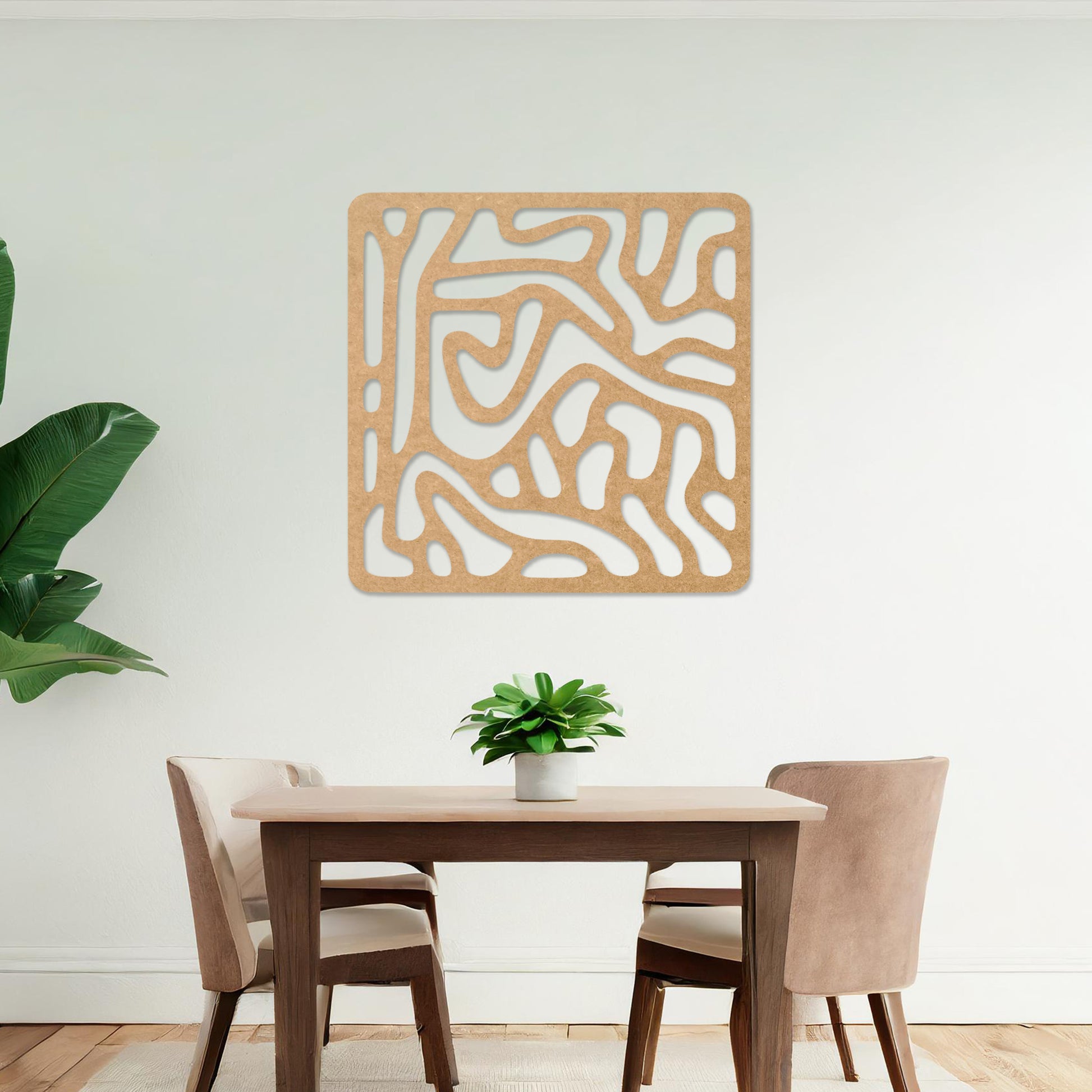 Wall art featuring an abstract design with flowing, interconnected organic shapes forming a bold pattern. The piece is displayed on a neutral wall within modern decor, adding a contemporary and artistic touch to the space.